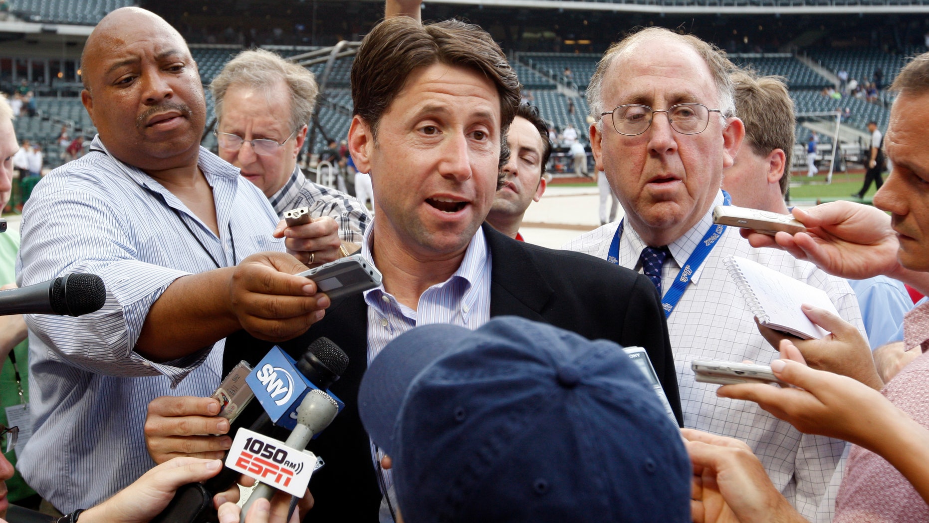 FILE: Jeff Wilpon speaks to members of the media on the field before the Mets' game against the Colorado Rockies at Citi Field in New York.