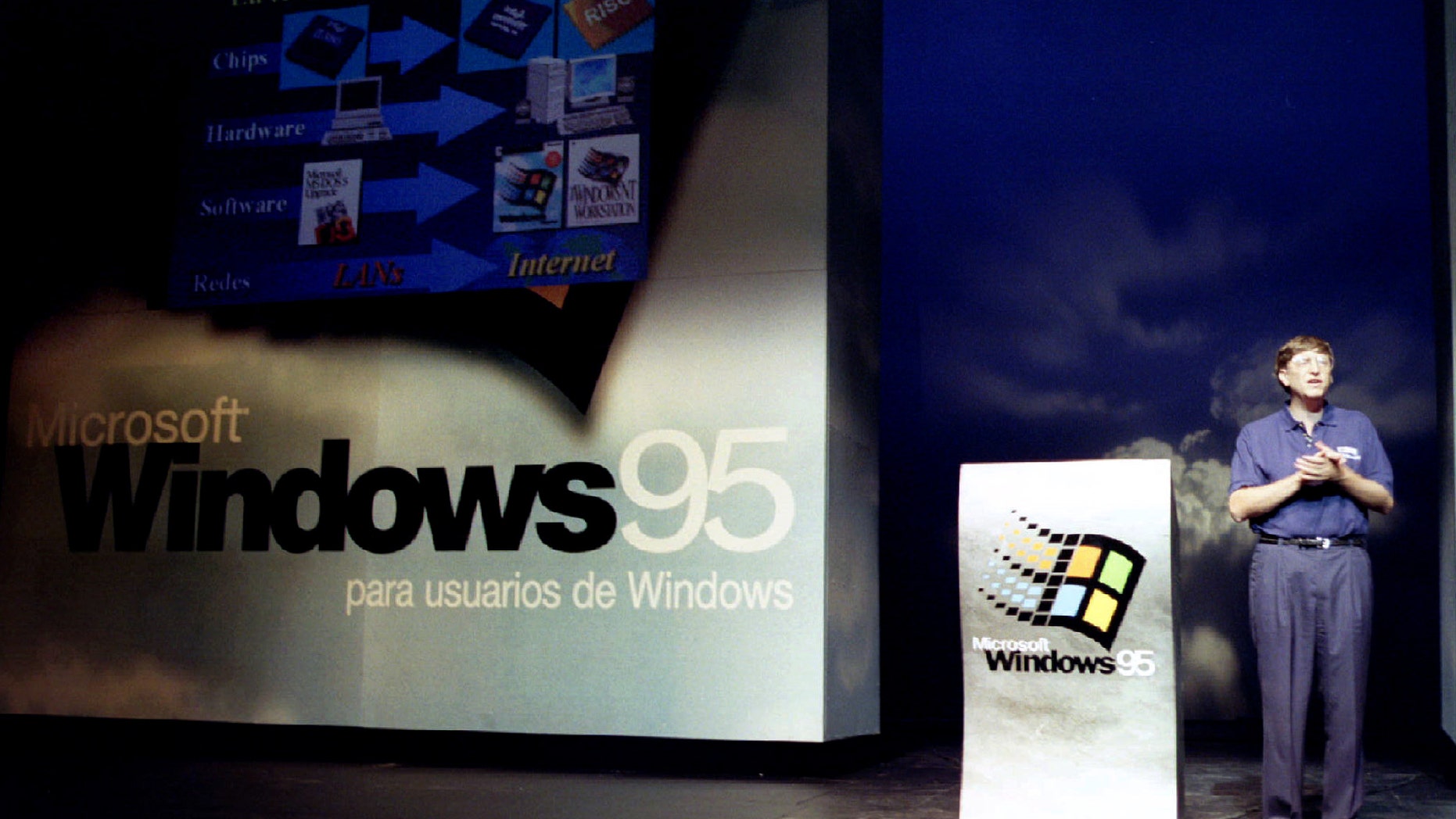 Bill Gates, chairman of software giant Microsoft, stands on stage during the launching of the new Windows 95 software to Spanish clients Sept. 5 at a Madrid theatre (Reuters).