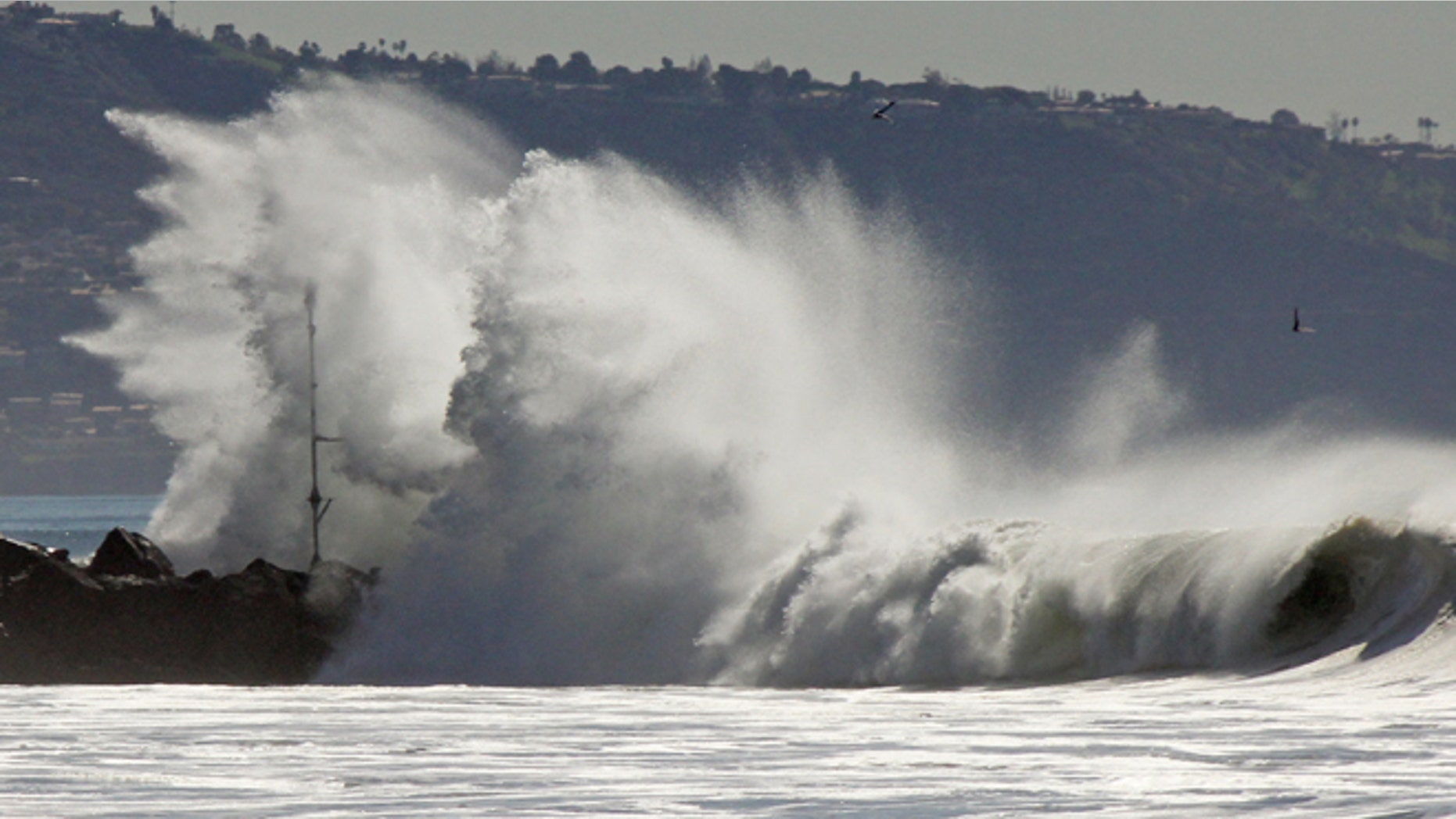 Jan. 24, 2015: Huge surf crashes over a jetty at El Segundo, Calif. (AP)