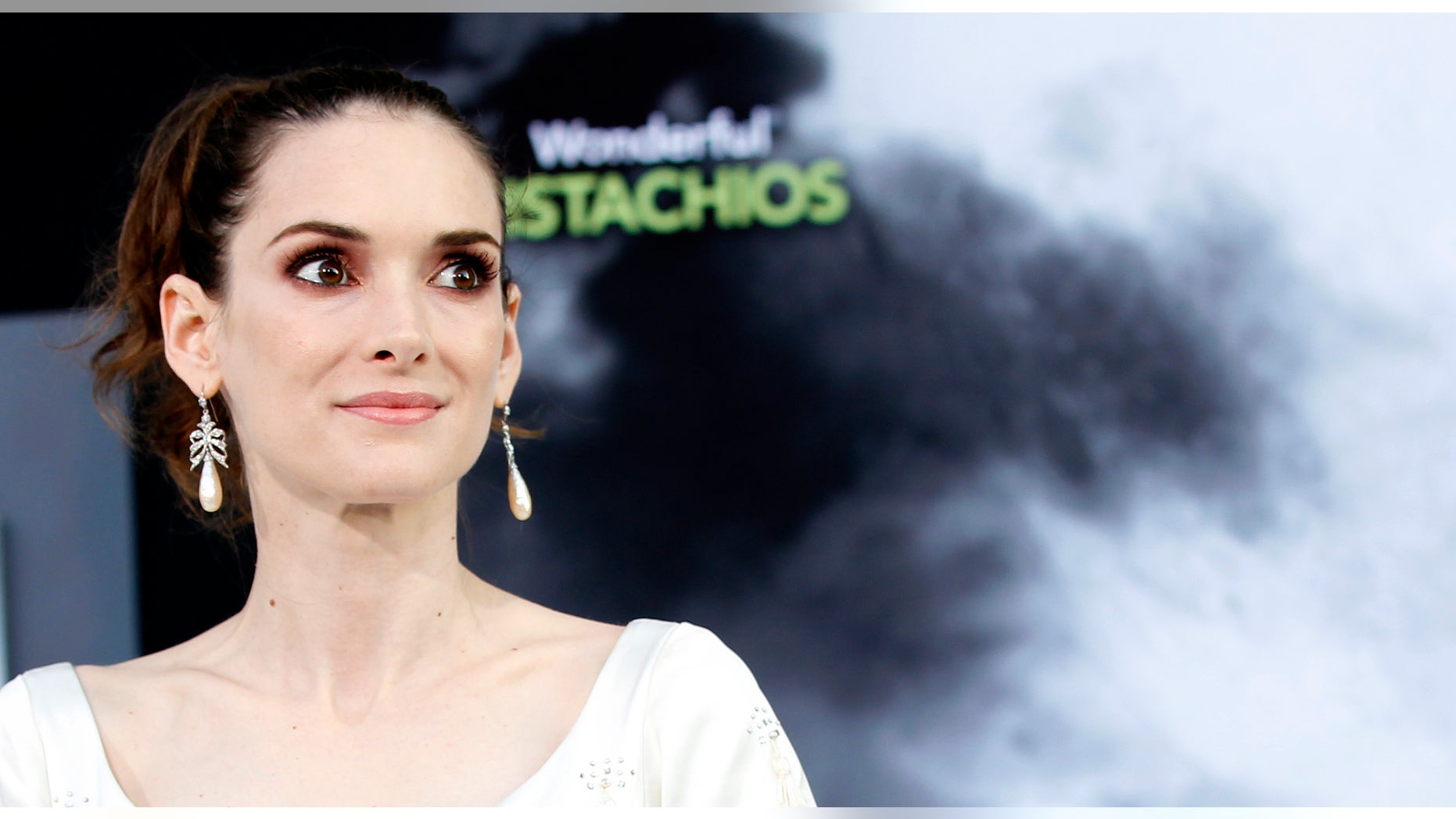 Cast member Winona Ryder poses at the premiere of "Frankenweenie" at El Capitan theatre in Hollywood, California September 24, 2012. The movie opens in the U.S. on October 5. REUTERS/Mario Anzuoni (UNITED STATES - Tags: ENTERTAINMENT) - RTR38DNM