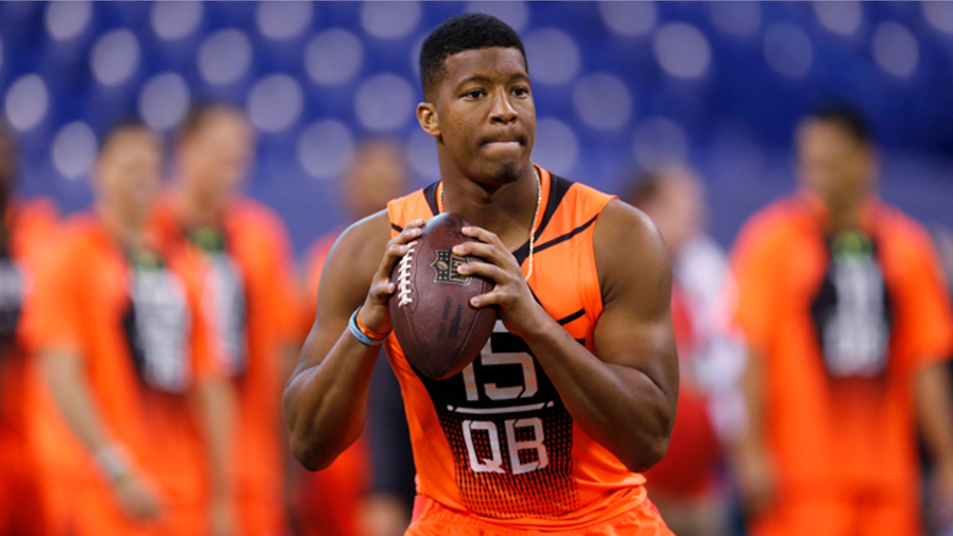 Feb. 21, 2015: Florida State quarterback Jameis Winston runs a drill at the NFL football scouting combine in Indianapolis.