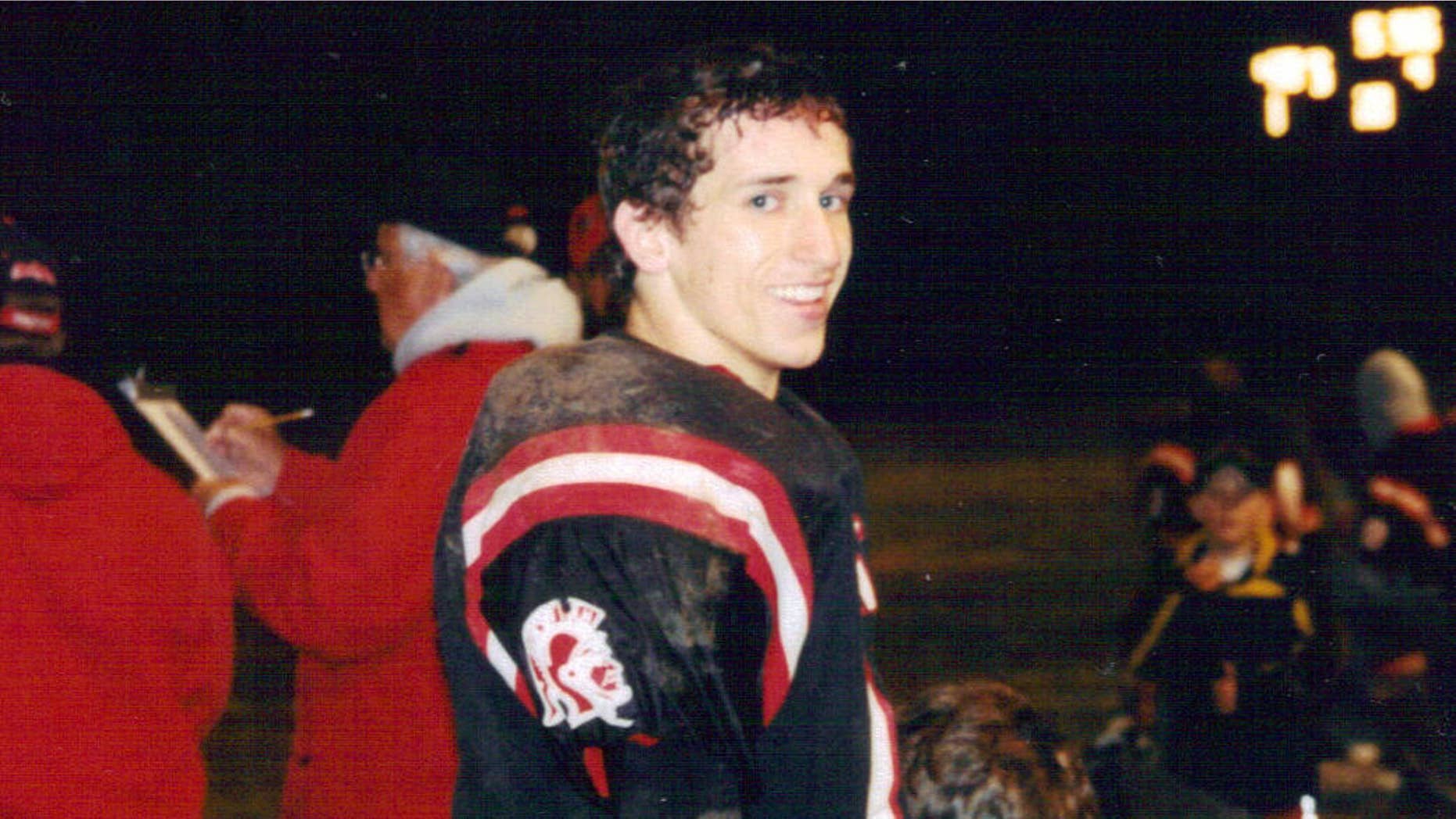 Feb. 5, 2015: Joseph Chernach stands on the sideline during a high school football game in Crystal Falls, Mich.