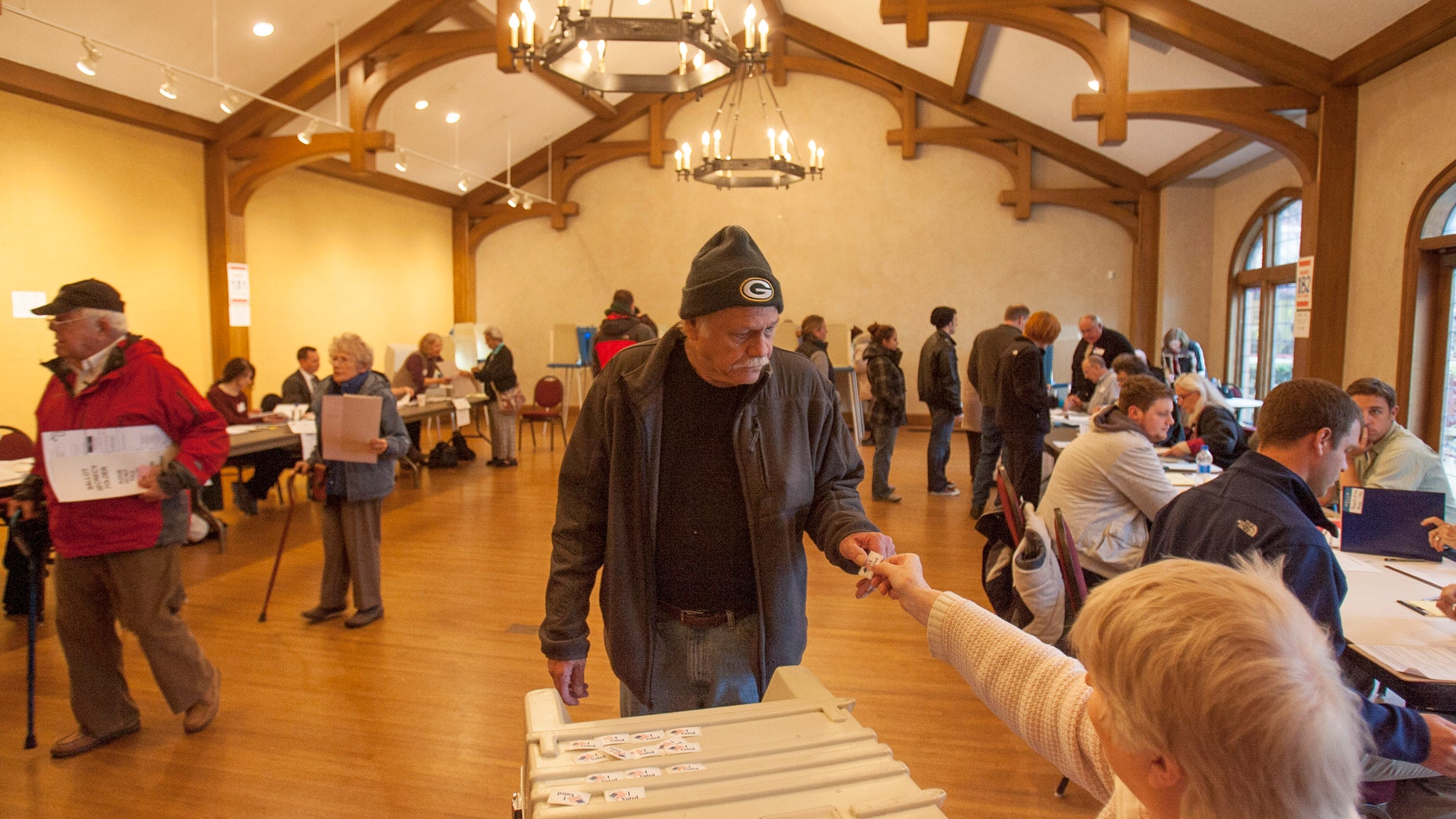 FILE: Voters at the Charles Allis Museum cast their ballots for the U.S. presidential election in Milwaukee, Wisconsin.