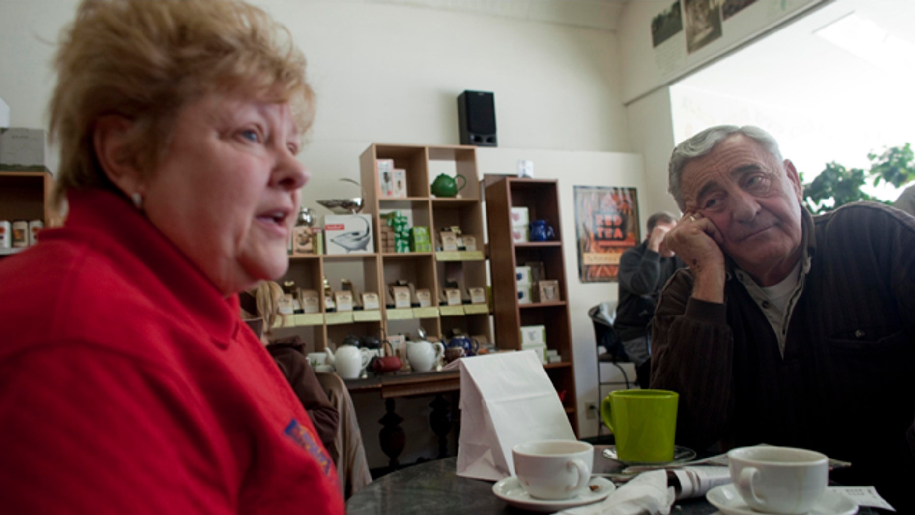 In this March 2, 2011 photo, Nancy, left, and her husband Harry Harrington talk about the Wisconsin budget crisis at Wilson's Coffee & Tea in Racine, Wis. There once was time when the Harrington's walked the picket line outside the nursing home where she was a medical aide, protesting the lack of a pension plan for the unionized work force. But those days of family solidarity are gone. Harry now blames years of union demands for an exodus of manufacturing jobs from this blue-collar city on the shore of Lake Michigan.