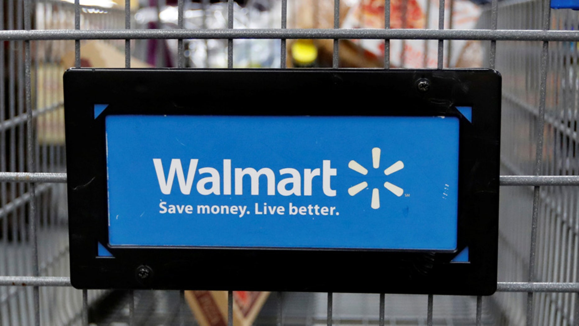 File photo: A customer pushes a shopping cart at a Walmart store in Chicago, Illinois, U.S. November 23, 2016. (REUTERS/Kamil Krzaczynski)