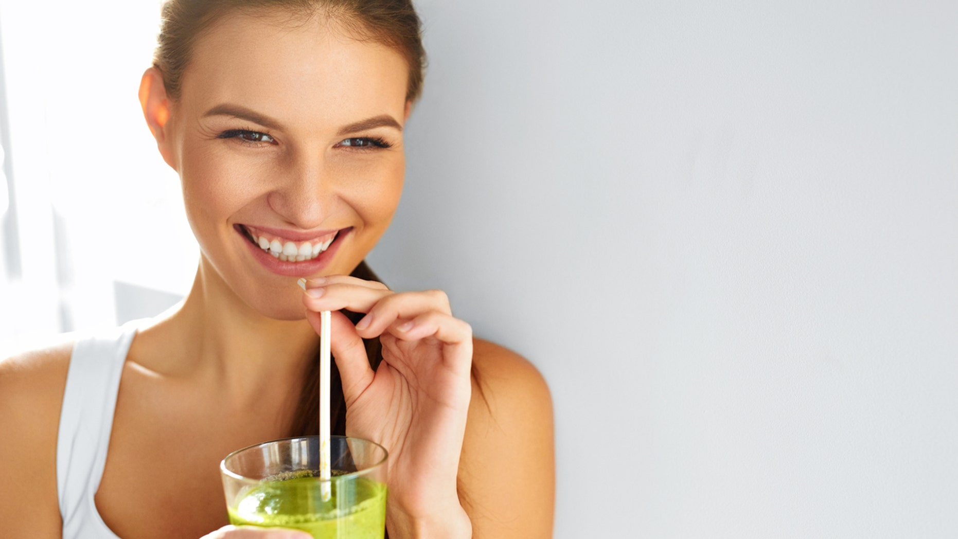 Healthy Food Eating. Happy Beautiful Smiling Woman Drinking Green Detox Vegetable Smoothie. Diet. Healthy Lifestyle, Vegetarian Meal. Drink Juice. Health Care And Beauty Concept.