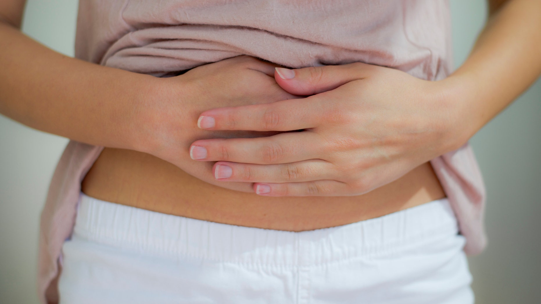 woman with hand on her stomach