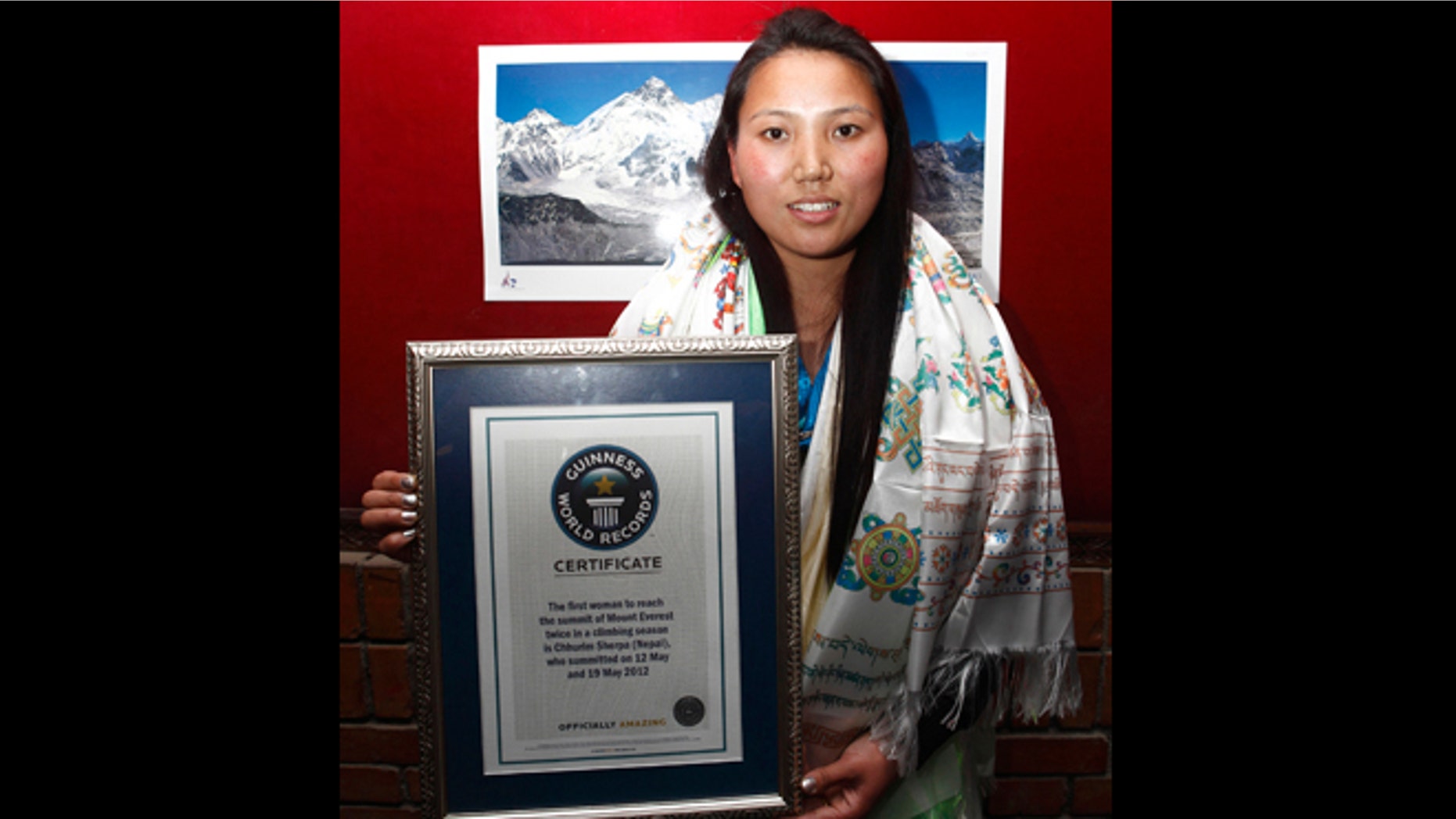 Feb. 25, 2013: Nepalese woman mountaineer Chhurim who has been recognized by Guinness World Records for climbing Mount Everest twice in the same climbing season poses with the certificate issued to her in Katmandu, Nepal.