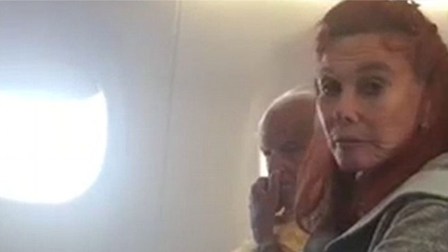 Police officers were called after a woman allegedly refuses to put her dog back in the carrier.