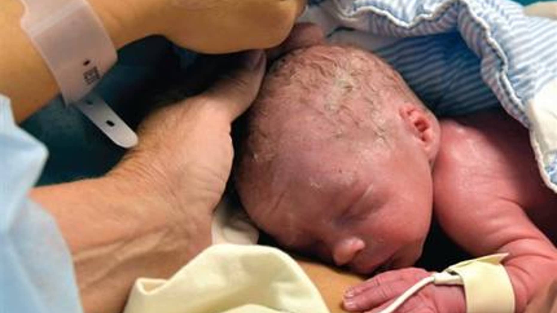 Oct. 4, 2014: In this photo provided by the Lancet, the world's first baby born to a woman with a transplanted womb, is shown after his birth in Goteborg, Sweden.