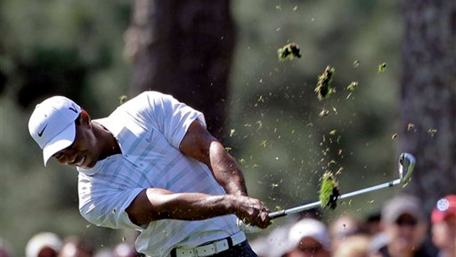 April 7, 2012: Tiger Woods hits off the first fairway during the third round of the Masters golf tournament in Augusta, Ga.