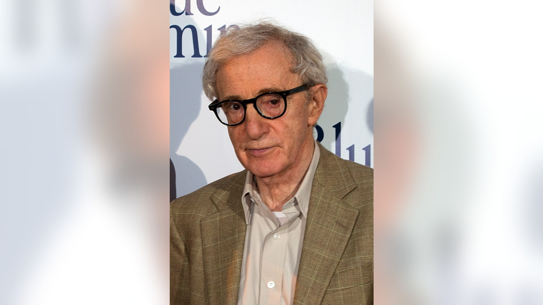 August 27, 2013. Woody Allen poses during the premiere of his film "Blue Jasmine" in Paris.