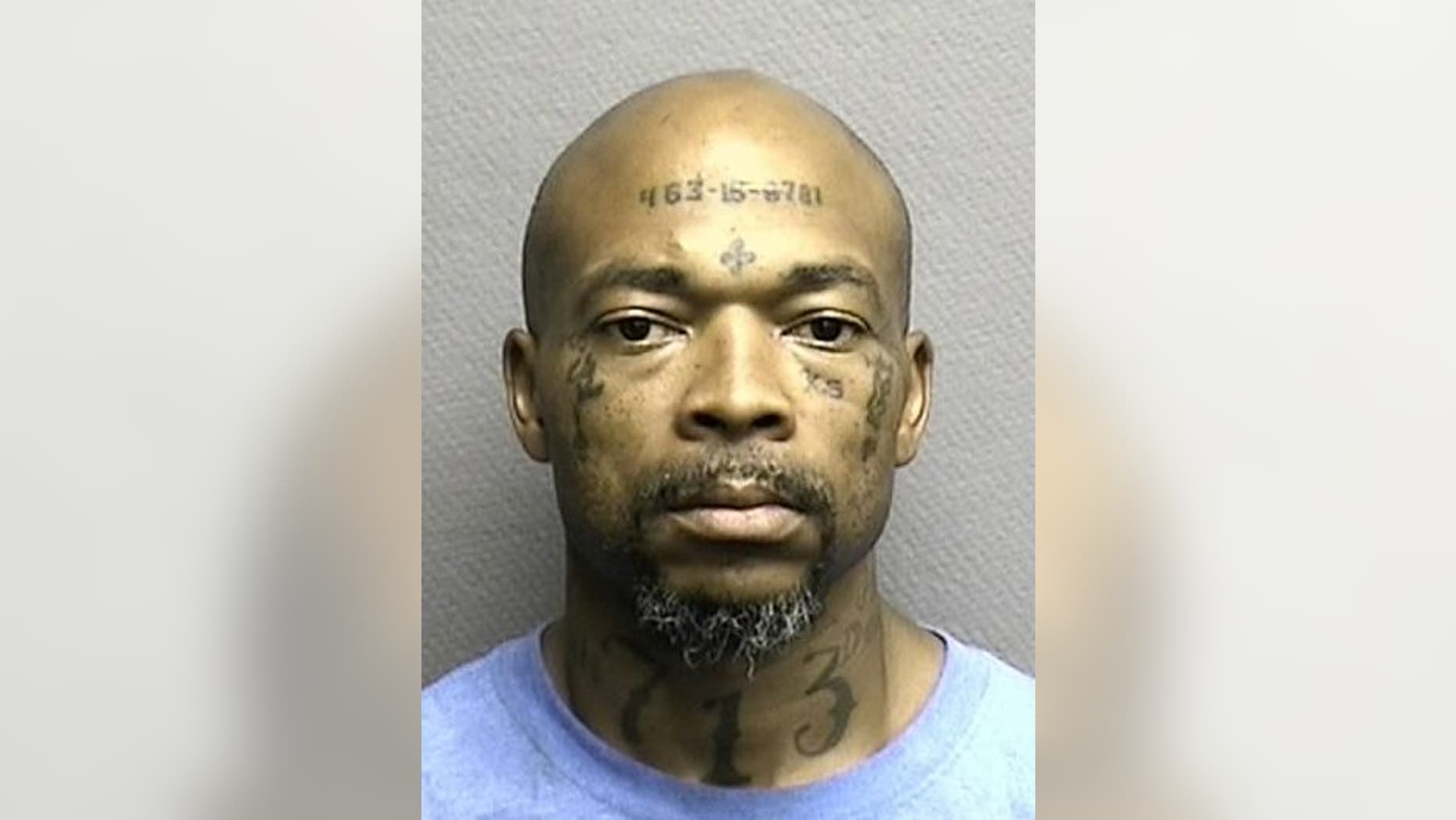 Robert Wooten has his social security number and the area code "713" tattooed on his face and neck.