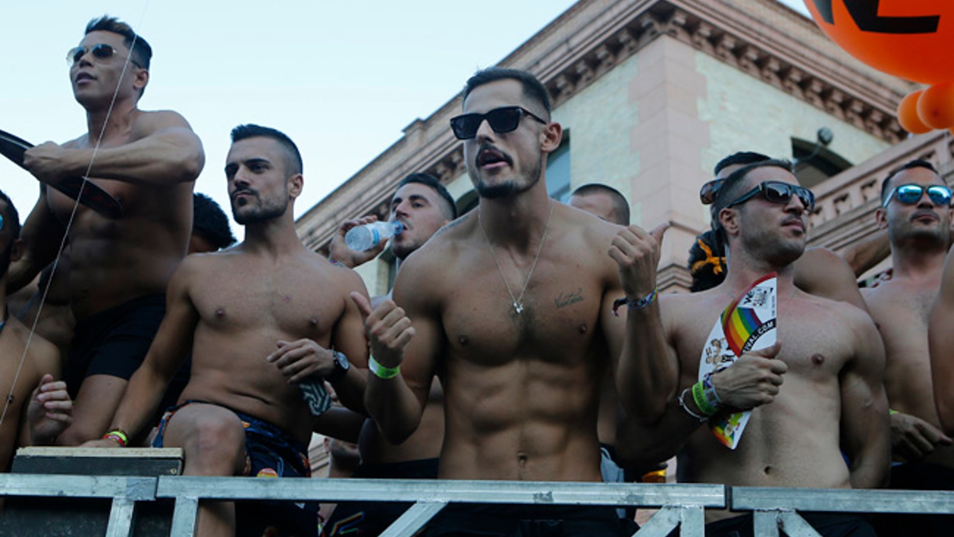 Participants dance on a open truck during the Gay Pride demonstration and parade, the climax of the 10-day WorldPride festivities, in Madrid, Spain, Saturday, July 1, 2017. Hundreds of thousands of people are marching in a global gay pride demonstration in Madrid under tight security measures on Saturday. (AP Photo/Paul White)