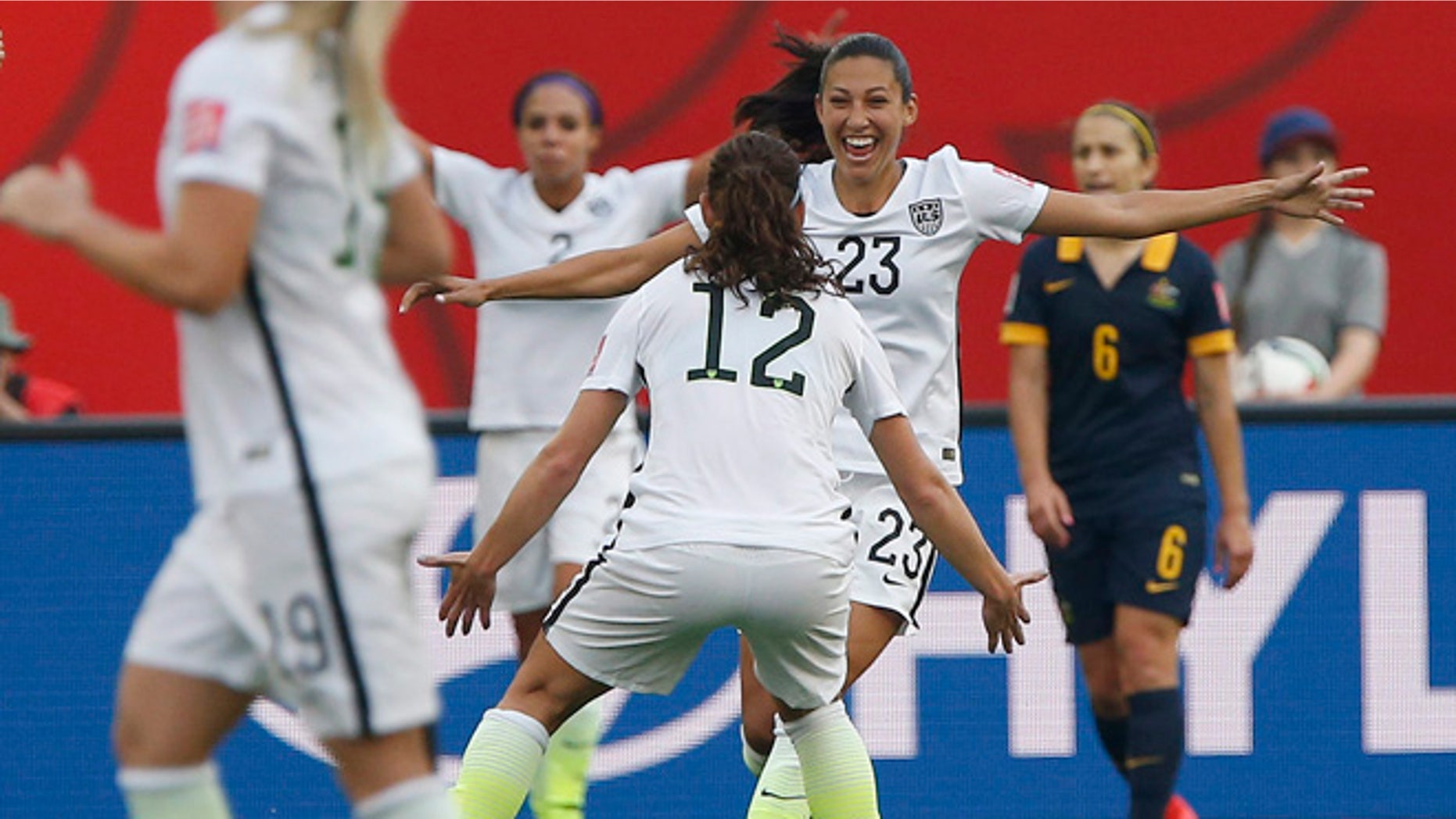 June 8, 2015: United States' Christen Press (23) celebrates her goal against Australia with Lauren Holiday (12) during a FIFA Women's World Cup soccer match in Winnipeg, Manitoba.