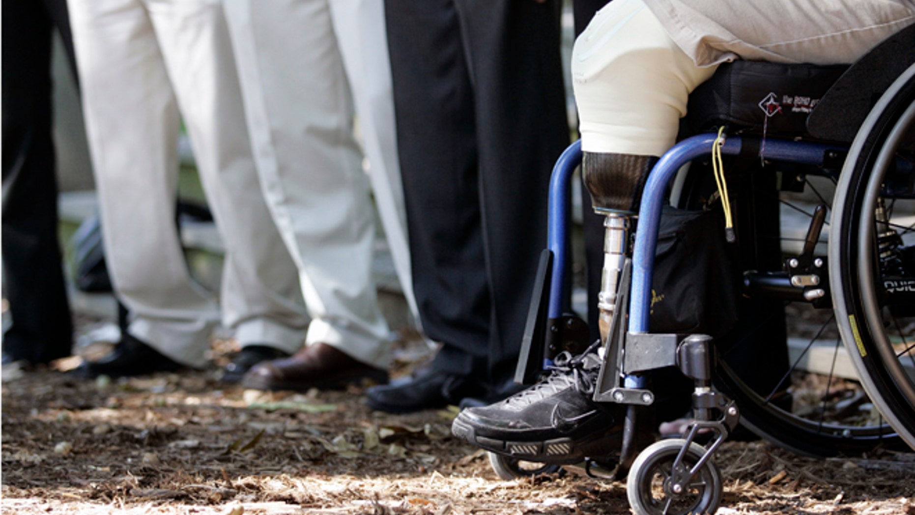 Wounded Iraq war veteran Joe Beimfohr sits among injured war veterans during a news conference held by the Wounded Warrior Project to urge Congress to pass a final version of the Dignified Treatment of Wounded Warriors Act.