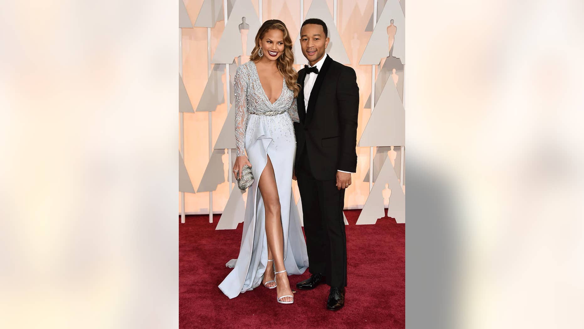 Model-turned-cookbook author Chrissy Teigen poses with husband, musician John Legend.