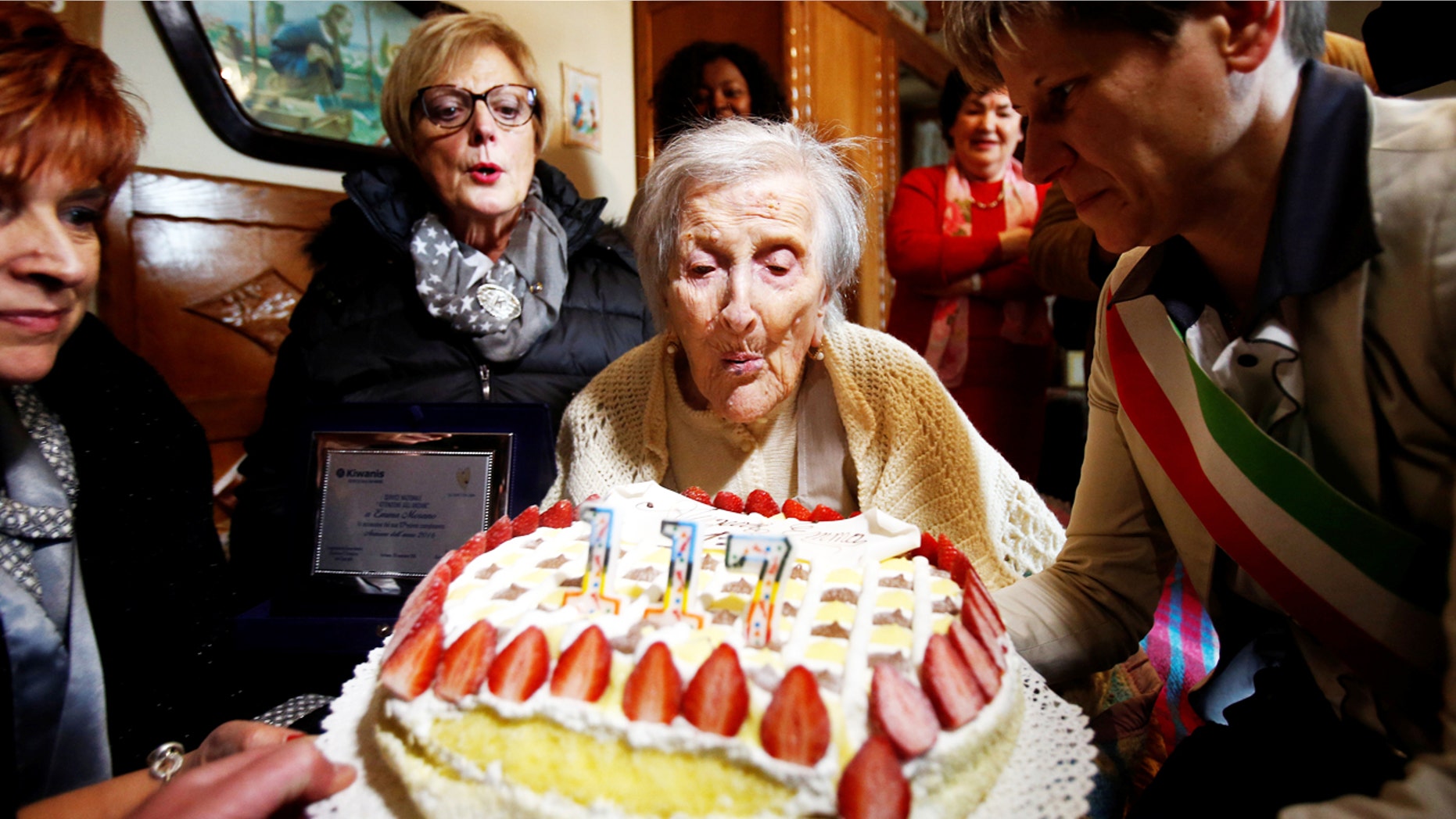 Emma Morano, thought to be the world's oldest person and the last to be born in the 1800s, blows candles during her 117th birthday in Verbania, northern Italy Nov. 29, 2011.