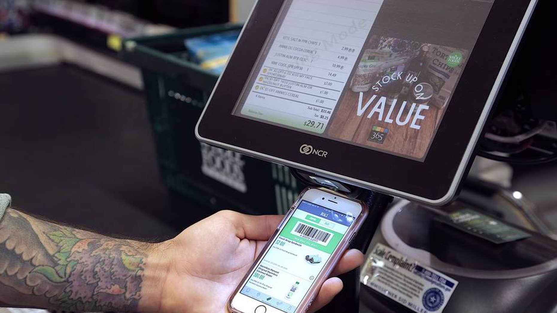 Whole Foods new rewards program works via smartphone app.