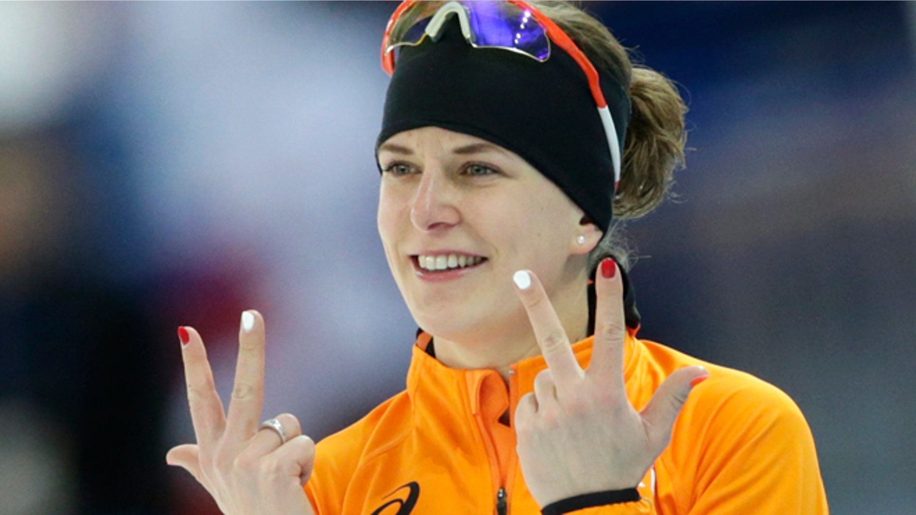 Feb. 9, 2014: Ireen Wust of the Netherlands flashes three fingers in each hand, indicating her third olympic gold medal, after winning gold in the women's 3,000-meter speedskating race at the Adler Arena Skating Center during the 2014 Winter Olympics in Sochi, Russia.