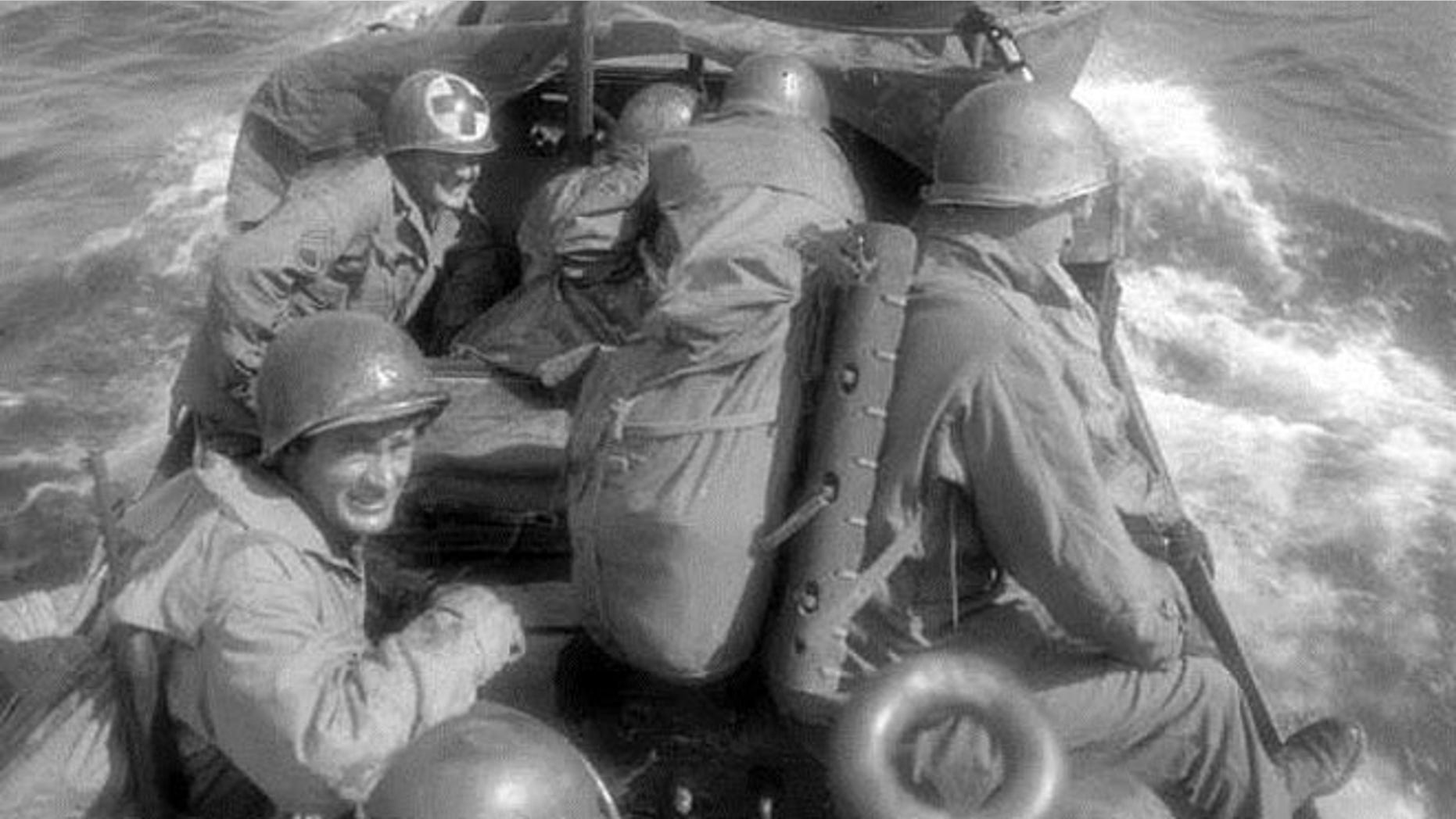 In this historic image provided by the Denver Public Library, an American amphibious vehicle crosses an Italian lake during World War II. A volunteer group’s discovery of what could be the wreckage of such a vehicle 900 feet below the surface of Italy's Lake Garda has given aging veterans hope that, after nearly seven decades, the remains of their comrades can finally be brought home for a proper burial.