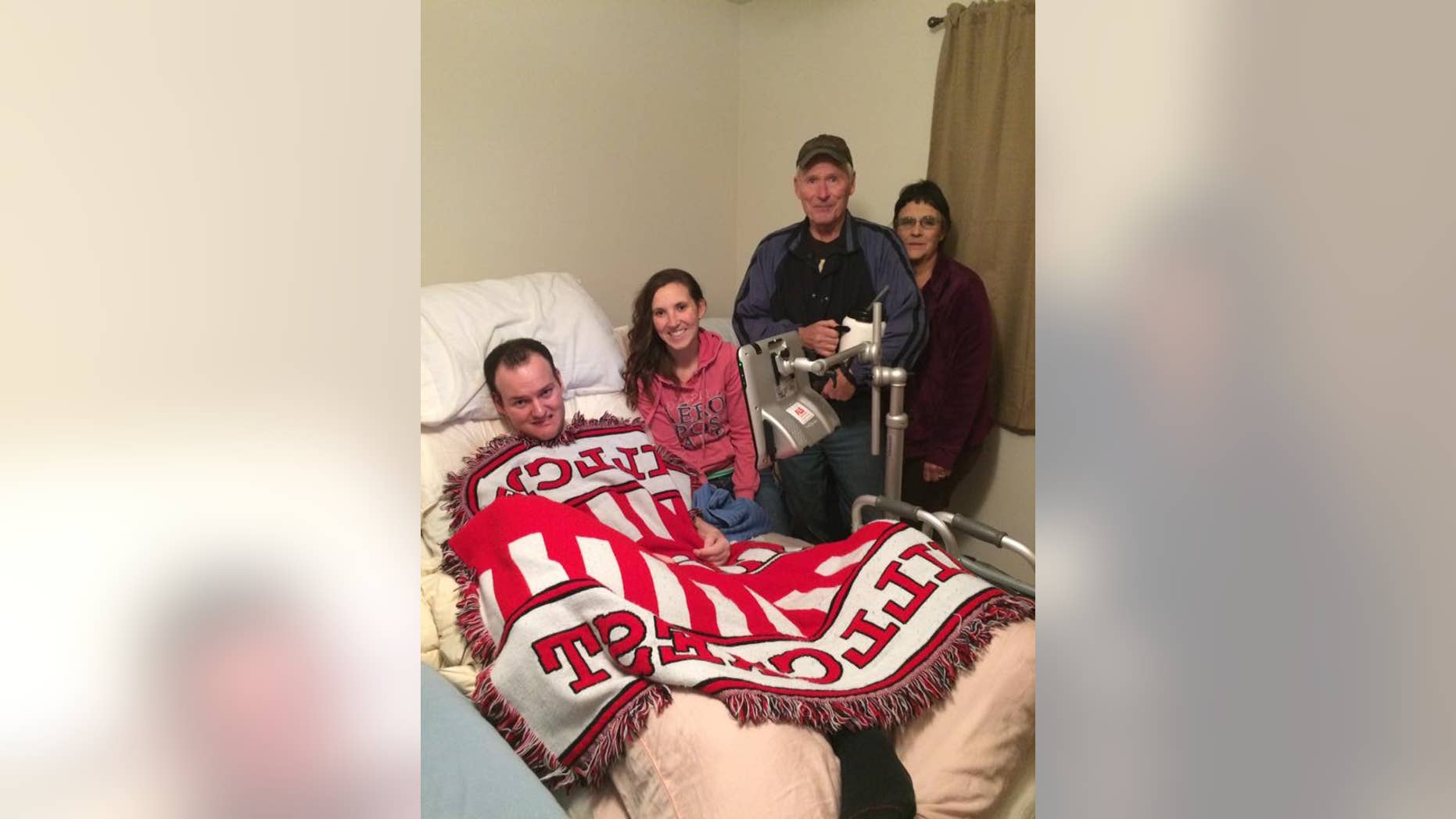 Wyatt Rees and his wife, Mindy, are pictured with the Clarks, who gave them an adaptive van after hearing about their story.