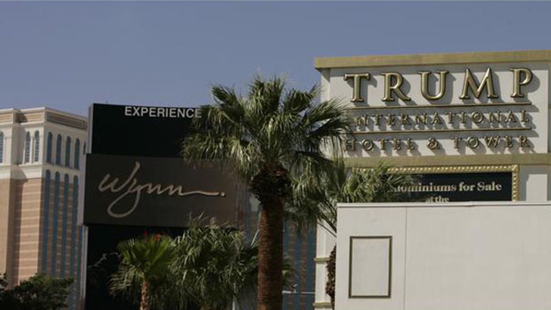 Shown here are the Venetian Hotel, Wynn Las Vegas Resort and a sign advertising the Trump International Hotel and Tower in Las Vegas. (AP Photo)