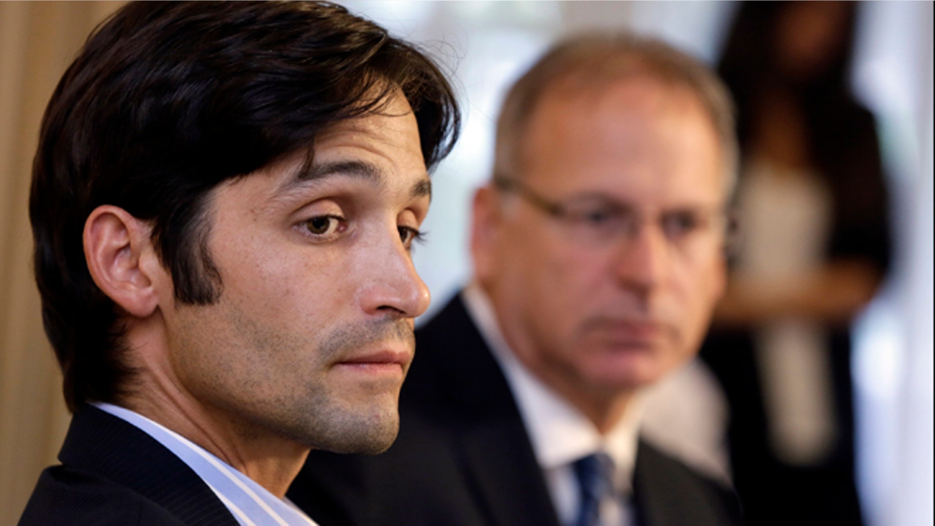 April 17, 2014: Plaintiff Michael Egan, left, with his attorney, Jeff Herman, take questions from the media during a news conference in Beverly Hills, Calif.
