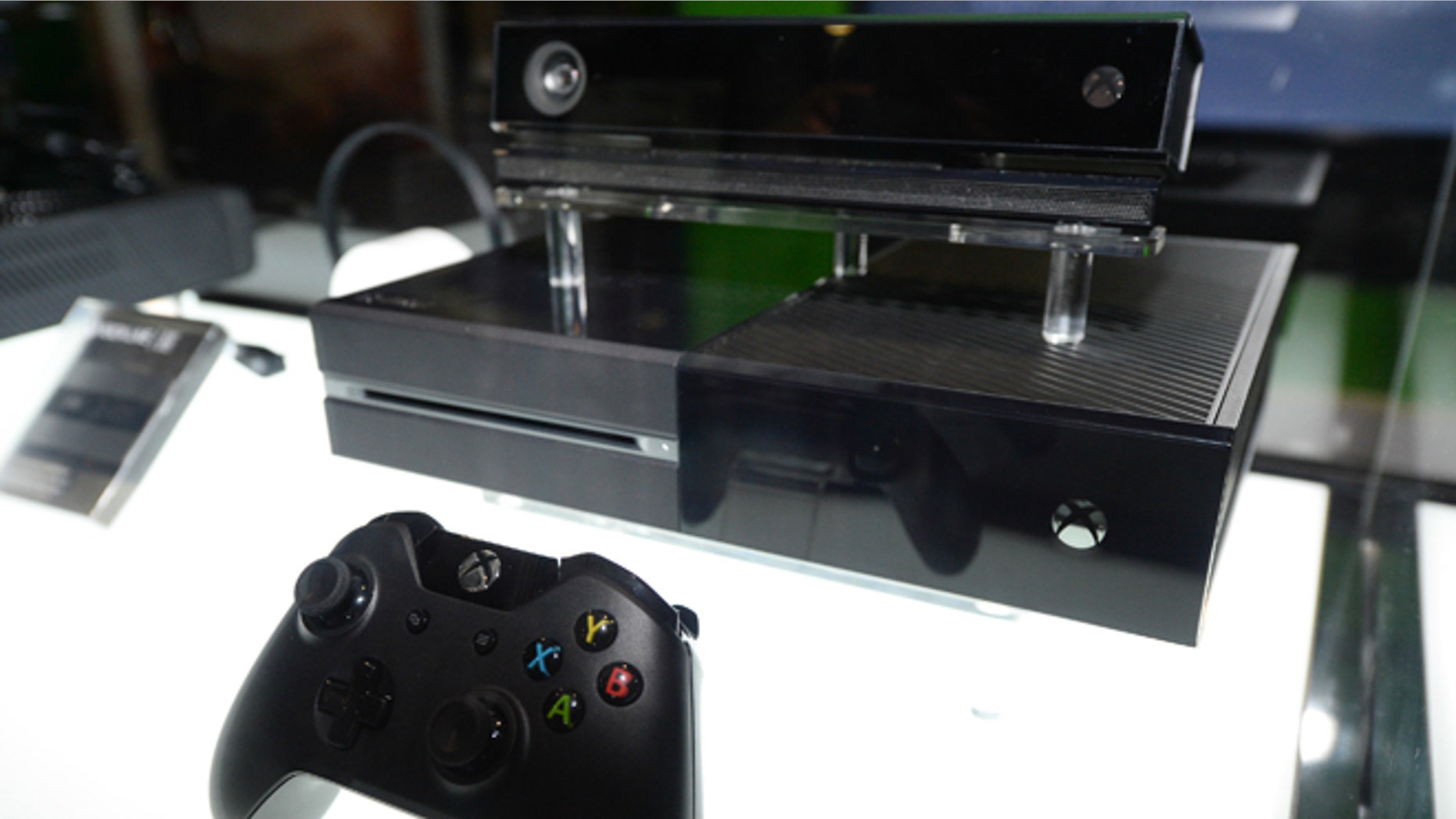 In this Aug. 28, 2013, file photo, the Microsoft Xbox One console, shown with Kinect, is on display at the GameStop Expo in Las Vegas.