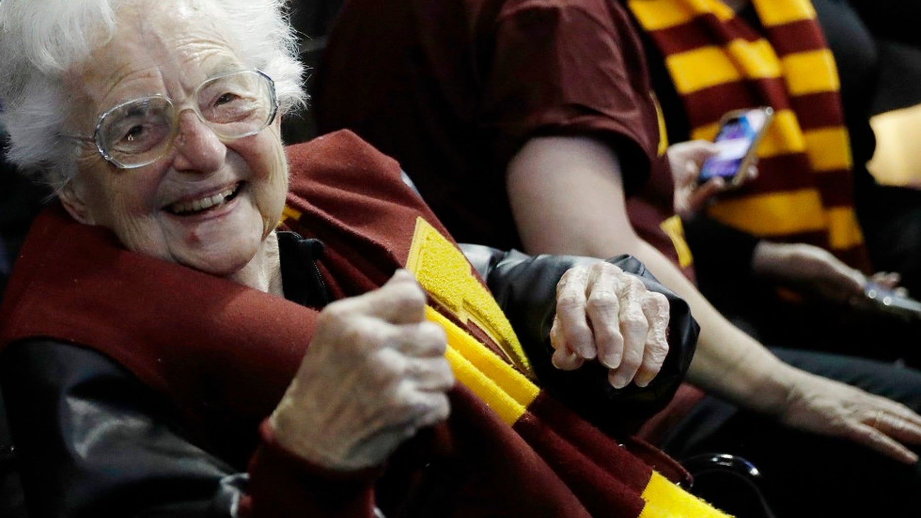 Sister Jean Dolores Schmidt sits with other Loyola-Chicago fans in Atlanta during a regional semifinal NCAA college basketball game against Nevada, March 22, 2018.
