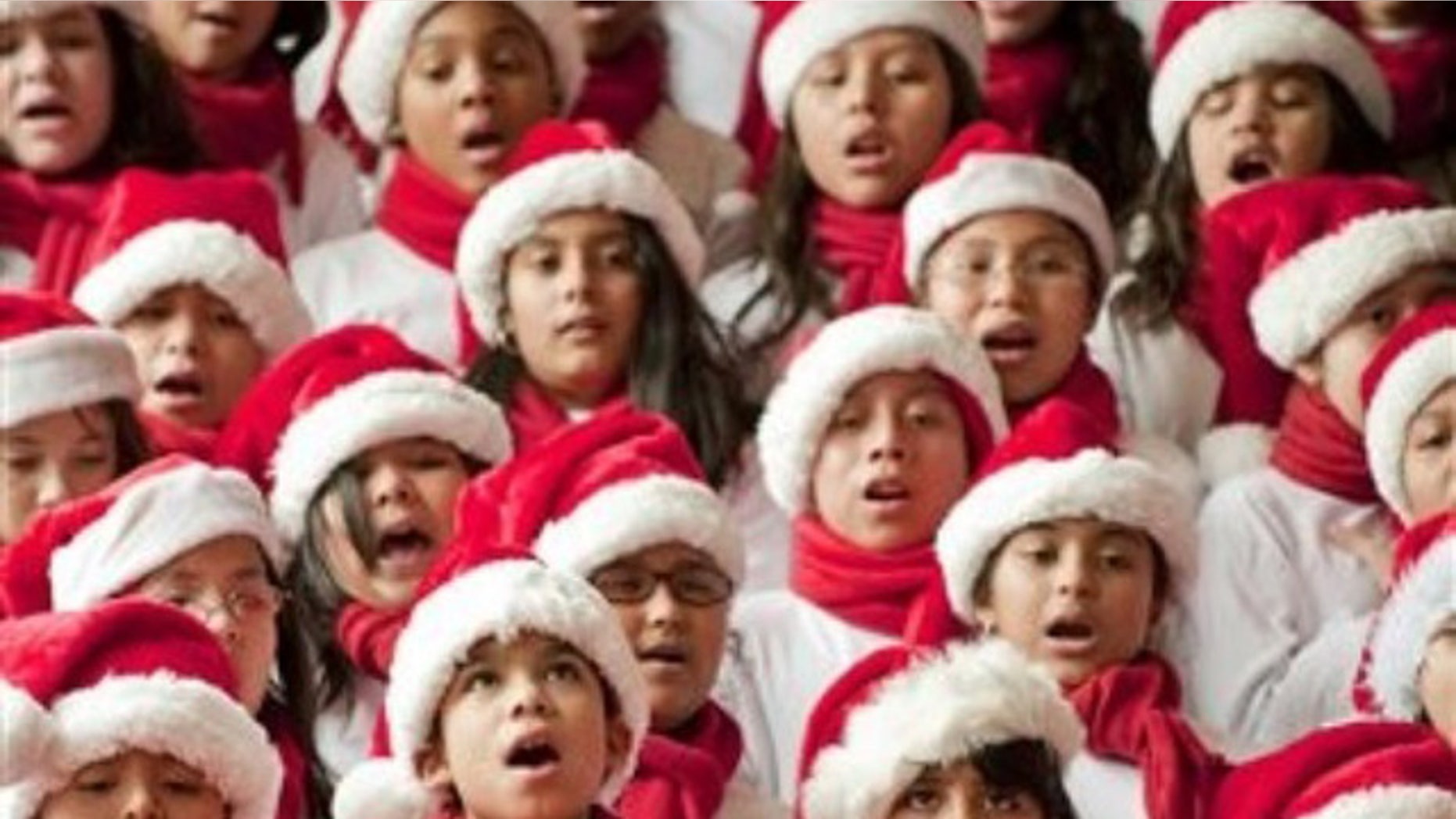 Students from the Pilgrim Academy sing Christmas songs in a hotel lobby. One accoustic researcher believes the notes in popular holiday tunes were borrowed from human speech.