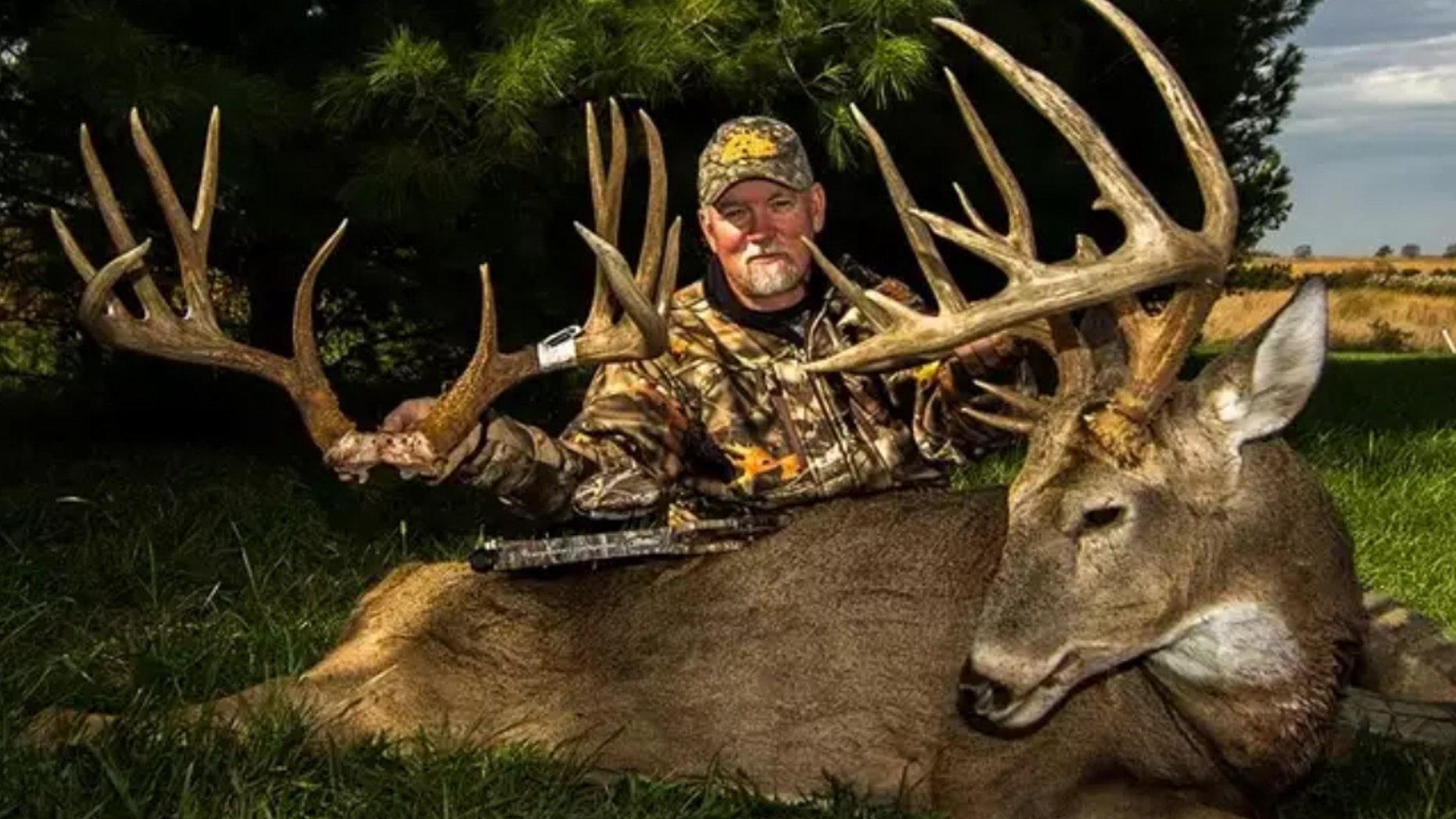 Illinois bowhunter Don Higgins poses with the rack of 206 6/8-inch “Smokey" and 193-inch brute “Trump," who he caught in the same week.