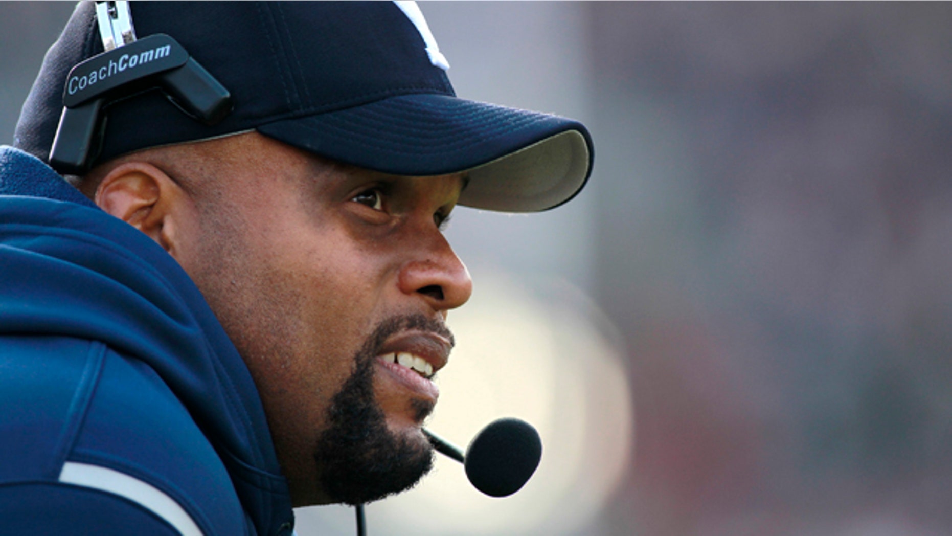 Nov. 20, 2010: This file photo shows Yale football coach Tom Williams watching from the sideline during the first half of a college football game against Harvard, in Cambridge, Mass.