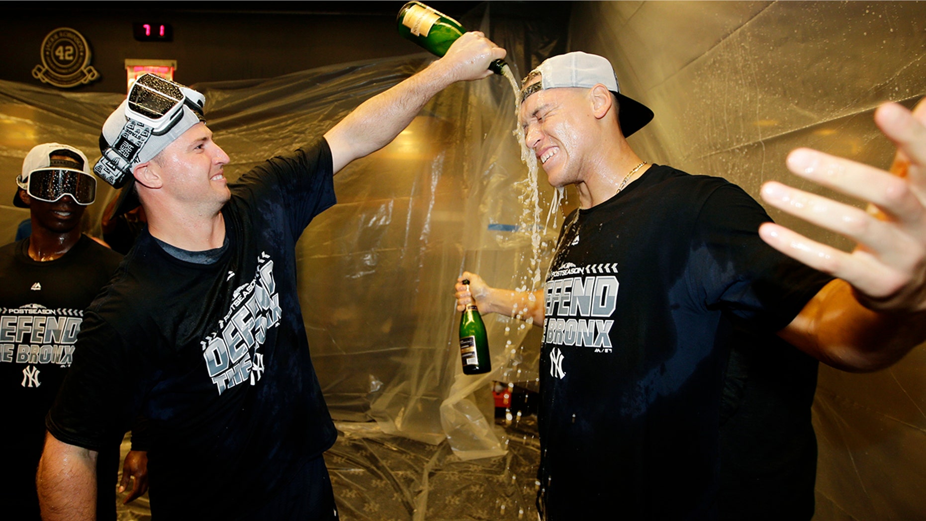 New York Yankees' Aaron Judge, right, celebrates with teammates after they clinched wildcard playoff berth with an 3-2 win over the Baltimore Orioles in New York, Sept. 22, 2018