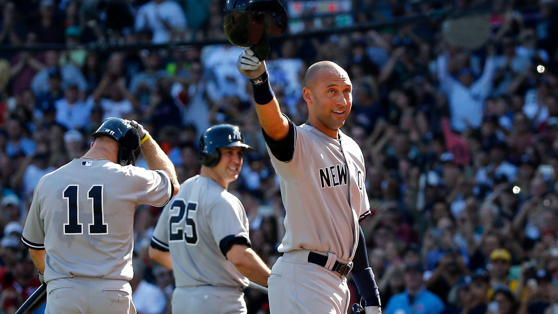 Sept. 28, 2014: New York Yankees designated hitter Derek Jeter tips his cap to the crowd at Fenway Park after coming out of the baseball game for a pinch-runner in the third inning against the Boston Red Sox in a baseball game.