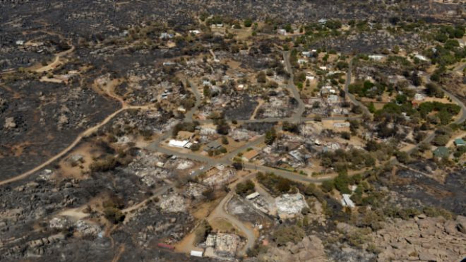 July 7, 2013: Several homes are seen destroyed by fire in Yarnell, Ariz.