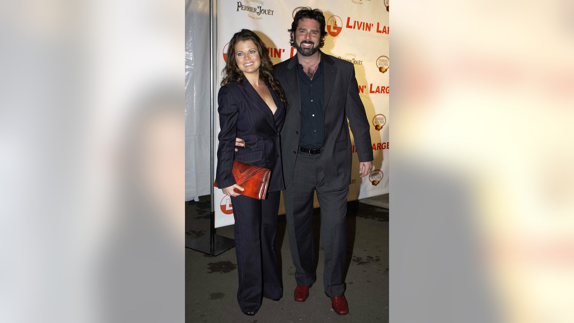 Yasmine Bleeth and partner Paul Cerrito at a party to celebrate the engagement of Carmen Electra to Dave Navarro at the Pacific Design centre in Los Angeles, CA in 2006.