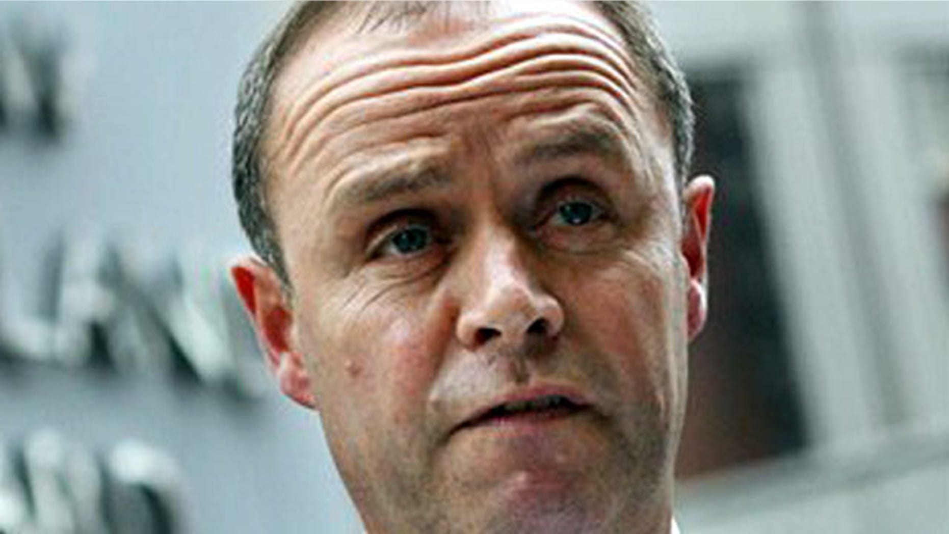 London's Metropolitan Police Assistant Commissioner John Yates stands outside the force's headquarters at New Scotland Yard in London, in this July 9 2009 file photo.