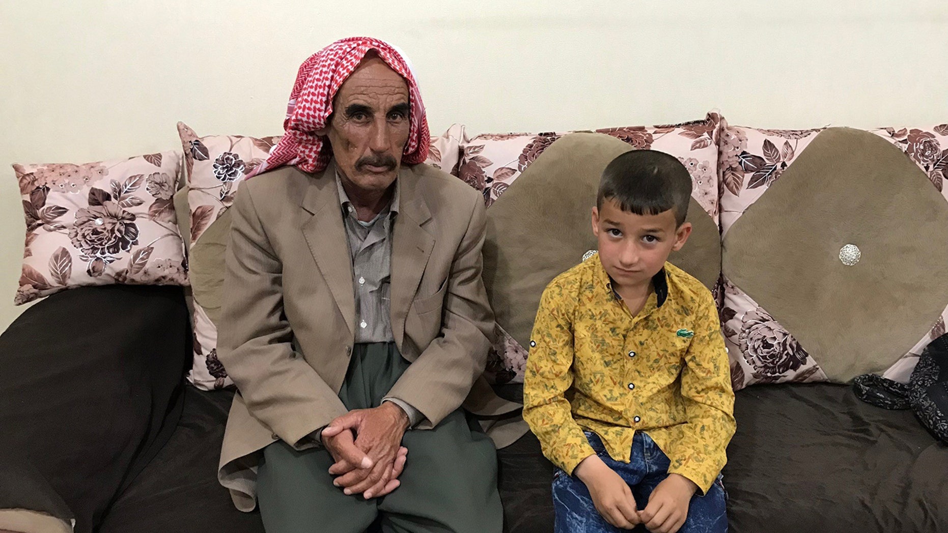 Yazidi father Kassim reunited with his son Lazem, 6, who was held by an ISIS family in Turkey