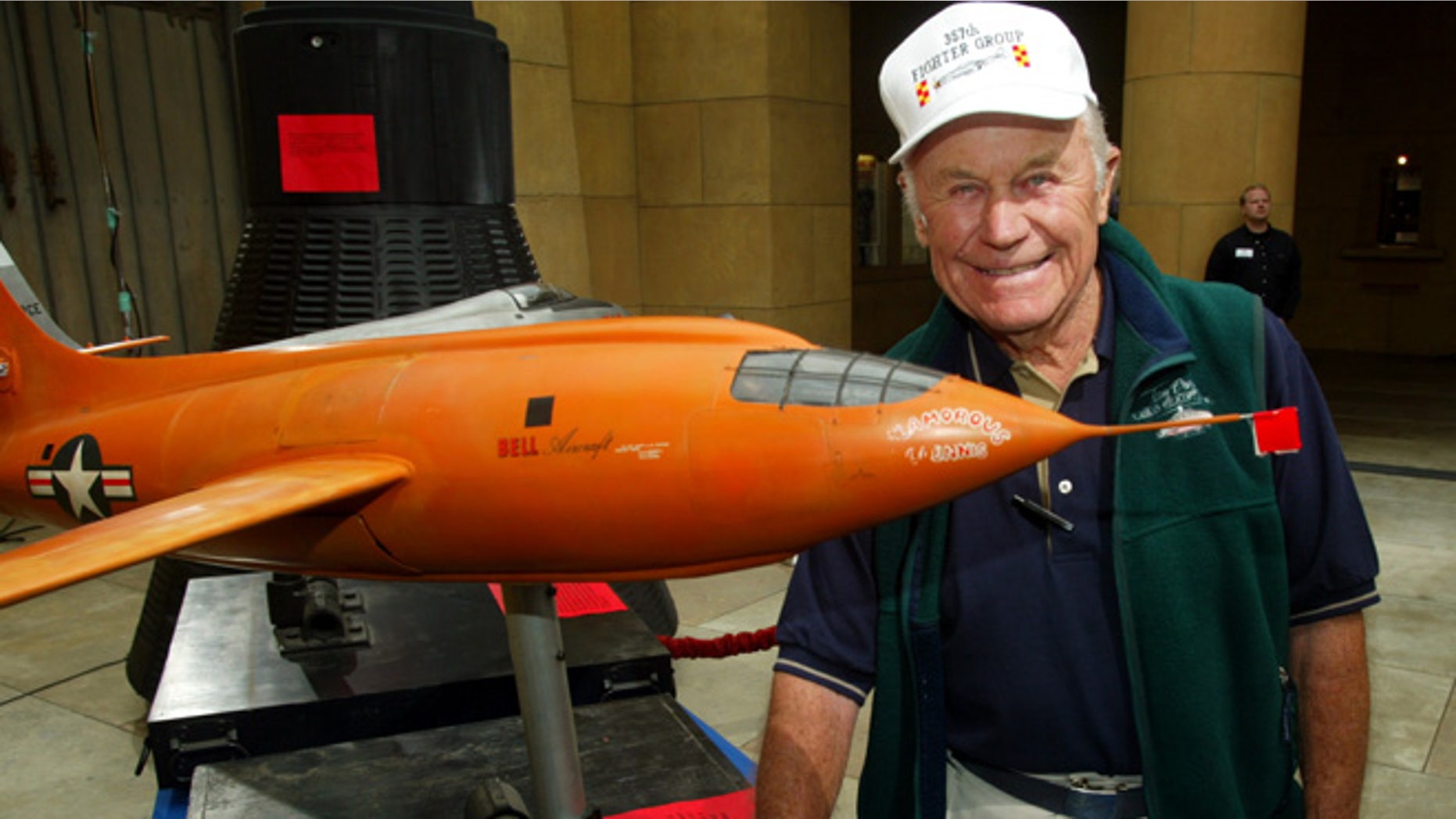 June 9, 2003: Gen. Chuck Yeager, the first pilot to break the sound barrier in the Bell X-1 "Glamorous Glinnis" in October 1947, poses next to a minature of the plane used in the film "The Right Stuff," at a screening in Hollywood.