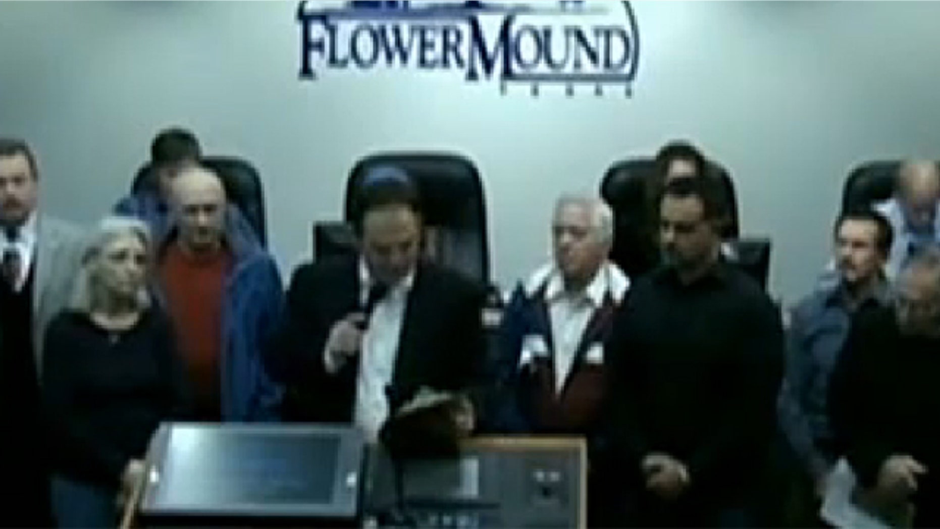 Mayor Tom Hayden declares 2014 the "year of the Bible" at a city council meeting in Flower Mound, Texas.