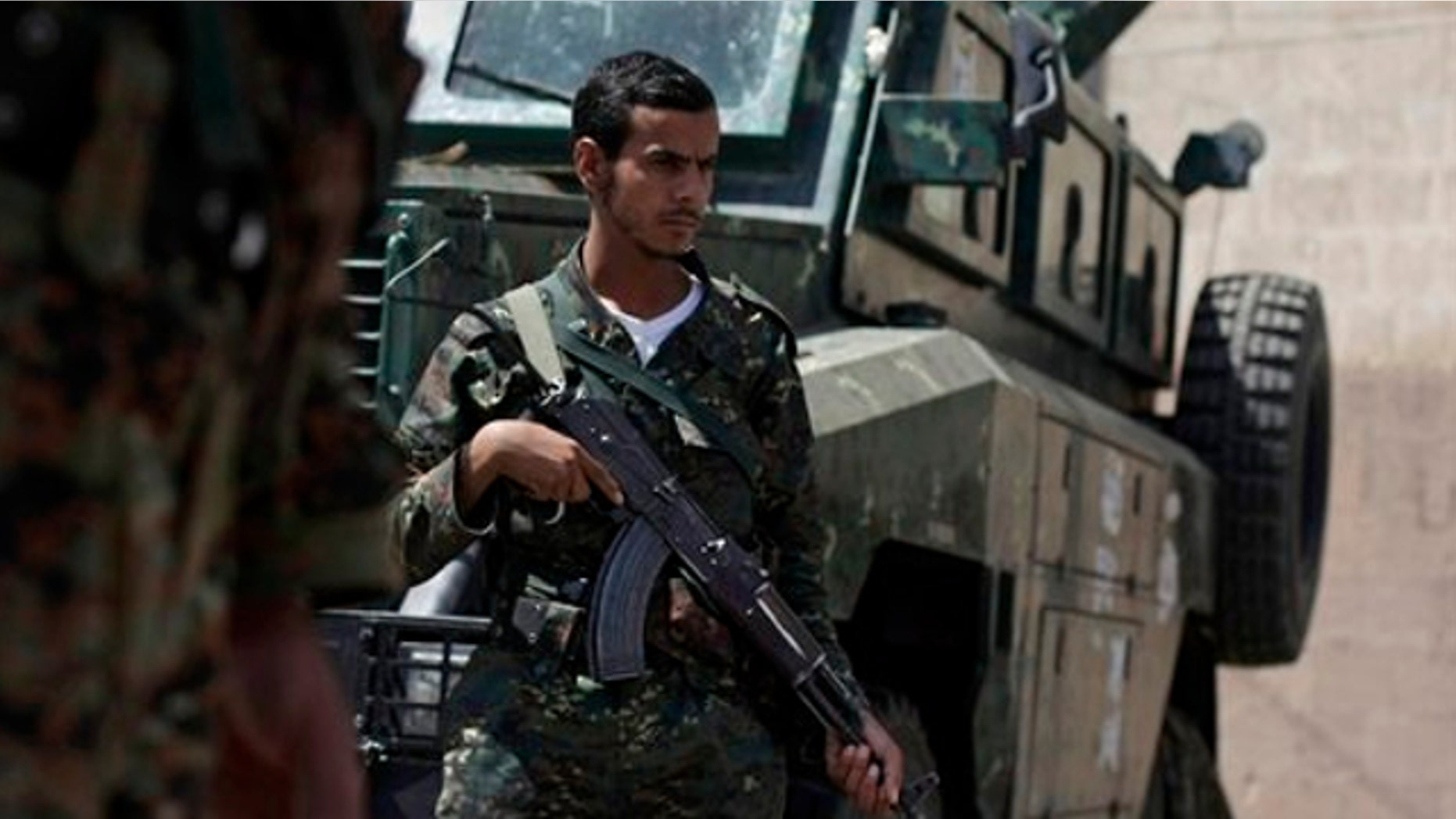 FILE: Aug. 10, 2013: Yemeni soldiers man a checkpoint on a street leading to the U.S. and British embassies in Sanaa, Yemen.