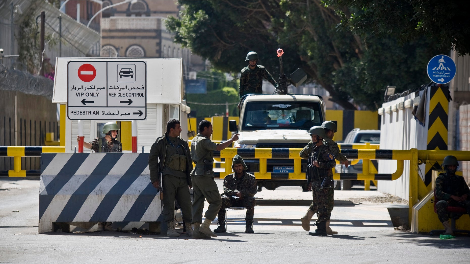 Jan. 17, 2015: Soldiers stand guard at the gate of the French Embassy, as Yemenis protest against caricatures published in French magazine Charlie Hebdo in front of the embassy in Sanaa, Yemen.