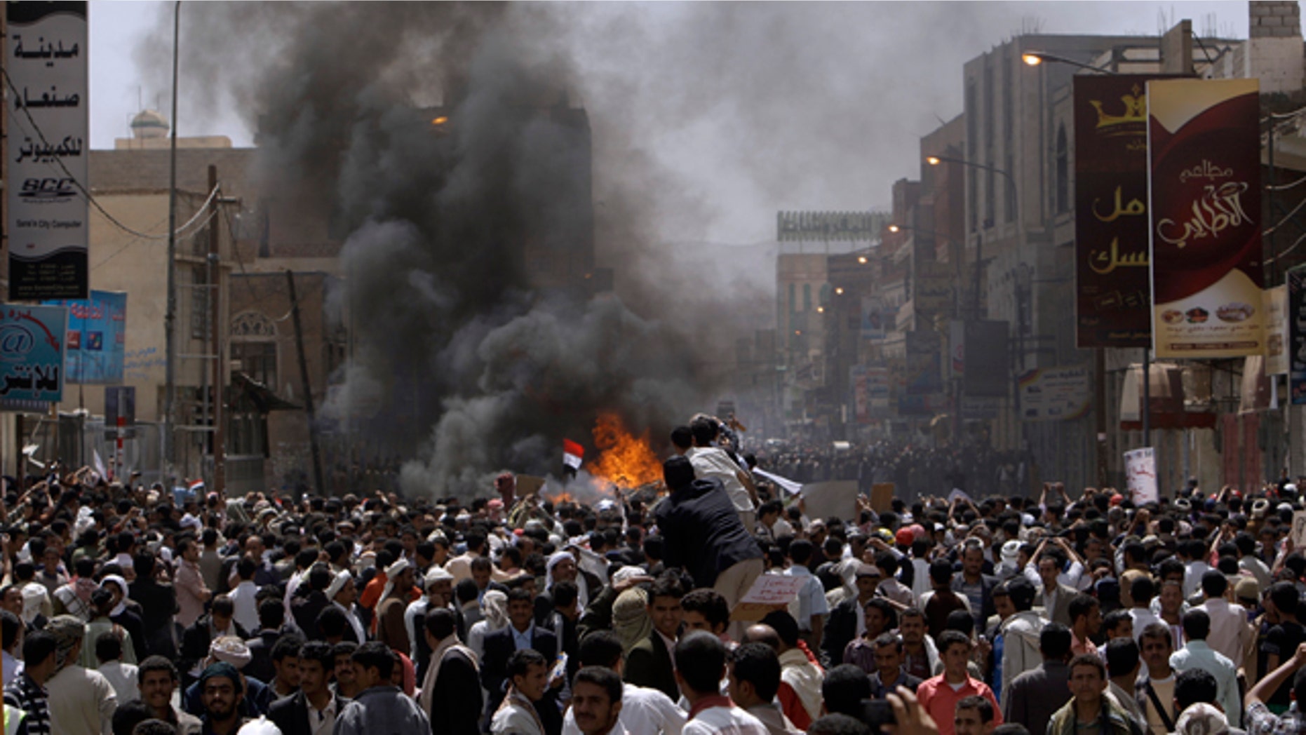 Feb. 22, 2011: Yemeni anti-government demonstrators gather during during clashes with supporters of President Ali Abdullah Saleh, in Sanaa, Yemen. Yemen's embattled leader rejects demands that he step down, calling demonstrations against his regime unacceptable acts of provocation and offers to begin a dialogue with protesters.