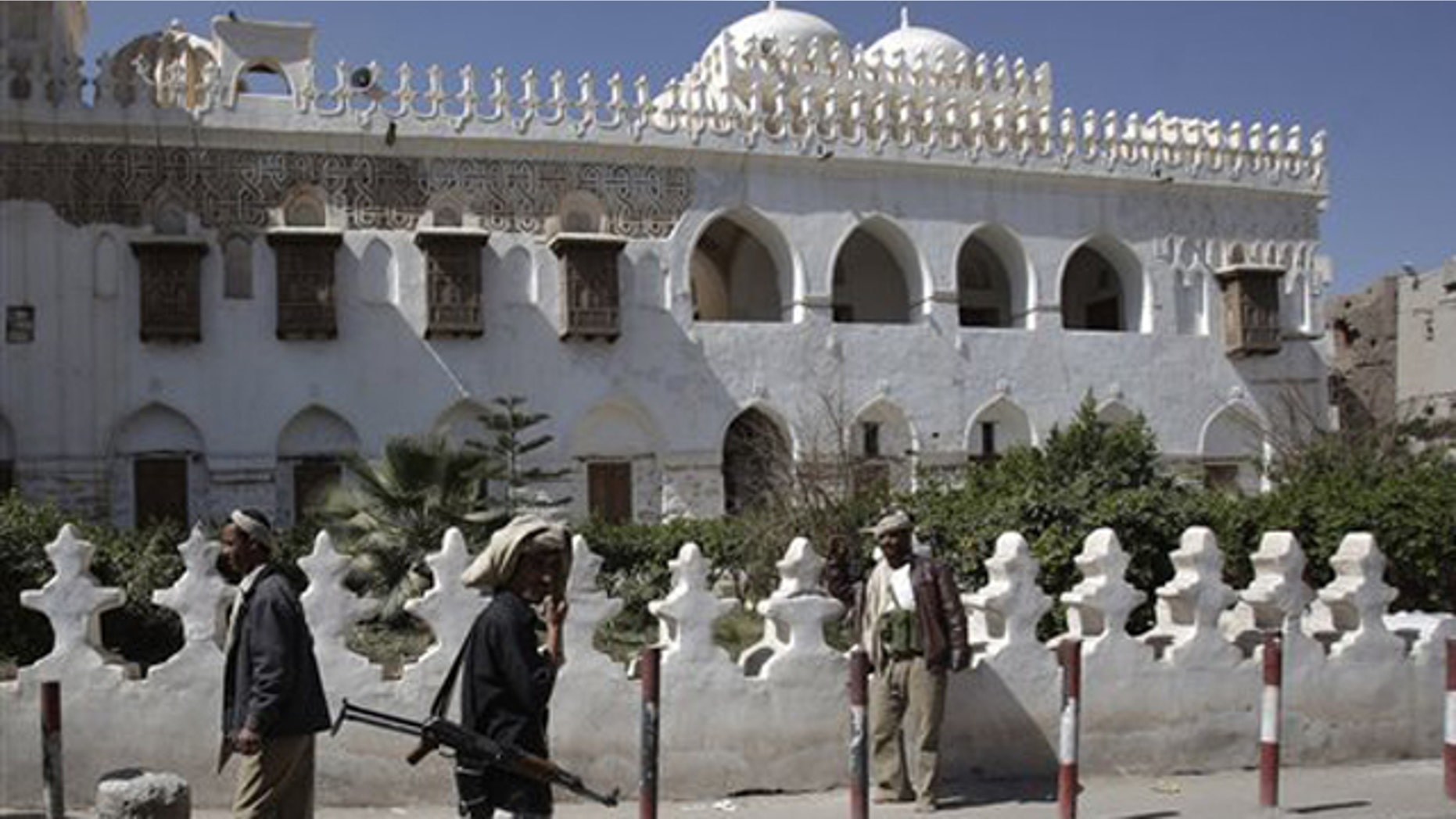 Jan. 25, 2012: Yemeni armed tribesmen stand guard in front of Ameriyah religious school which was seized by Al Qaeda militants in Radda town, 100 miles south of the capital Sanaa, Yemen.
