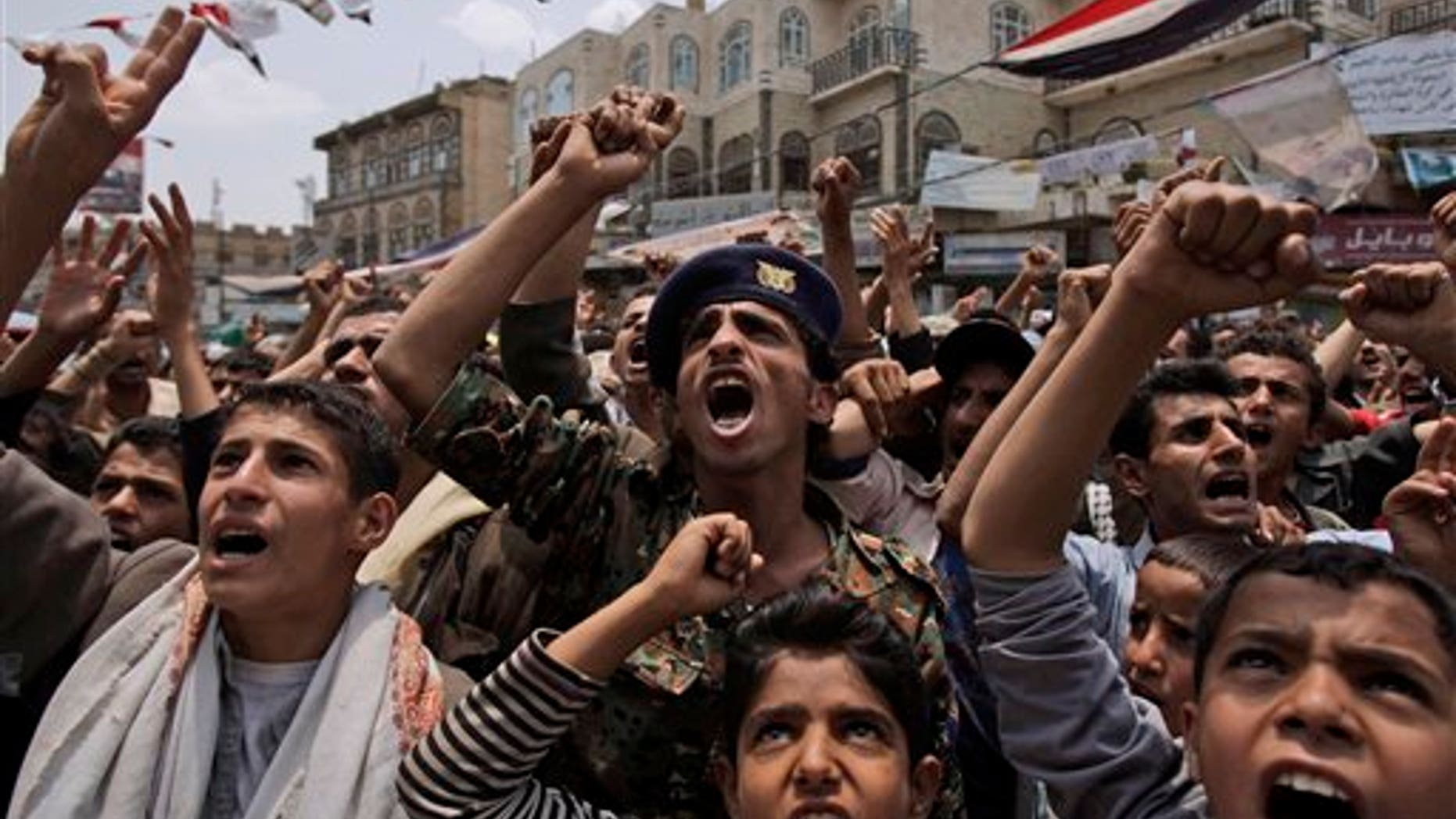 June 29: Anti-government protestors, shout slogans during a demonstration demanding the resignation of Yemeni President Ali Abdullah Saleh, in Sanaa, Yemen. Yemeni government warplanes and artillery pounded several villages of anti-government tribes north of the capital on Tuesday, killing at least three people, a senior tribal leader said.