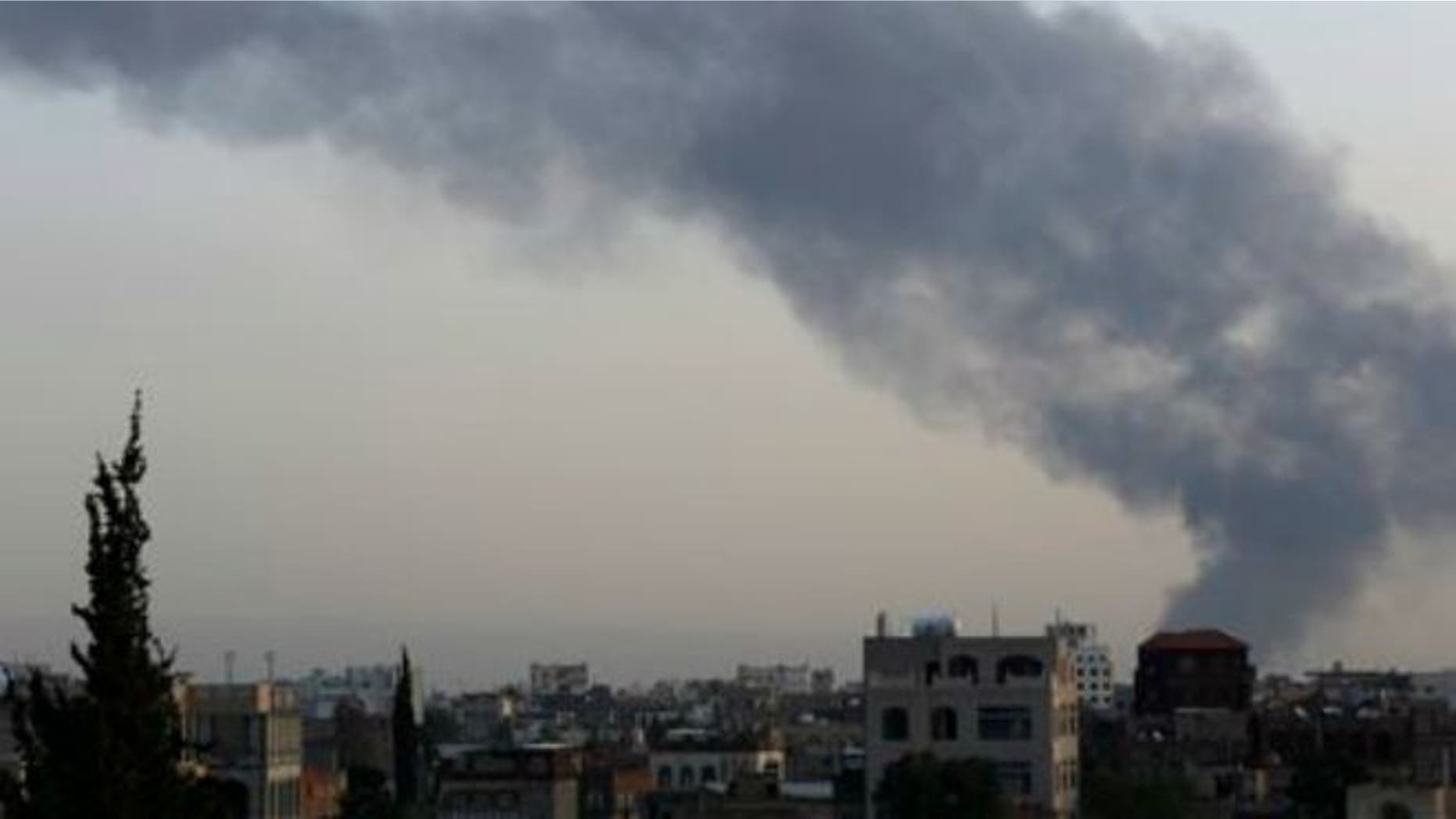 Sept. 2, 2015: Smoke rises after an airstrike by the Saudi-led coalition at an army base in Sanaa, Yemen.