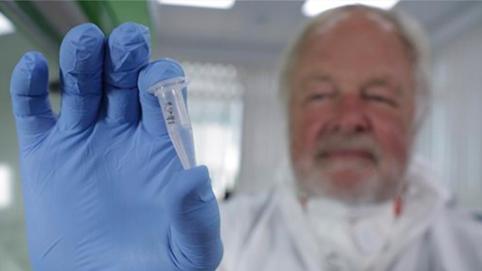 UNDATED: This photo made available by Britain's Channel 4 television shows Oxford University genetics professor Bryan Sykes posing with a prepared DNA sample taken from hair from a Himalayan animal.