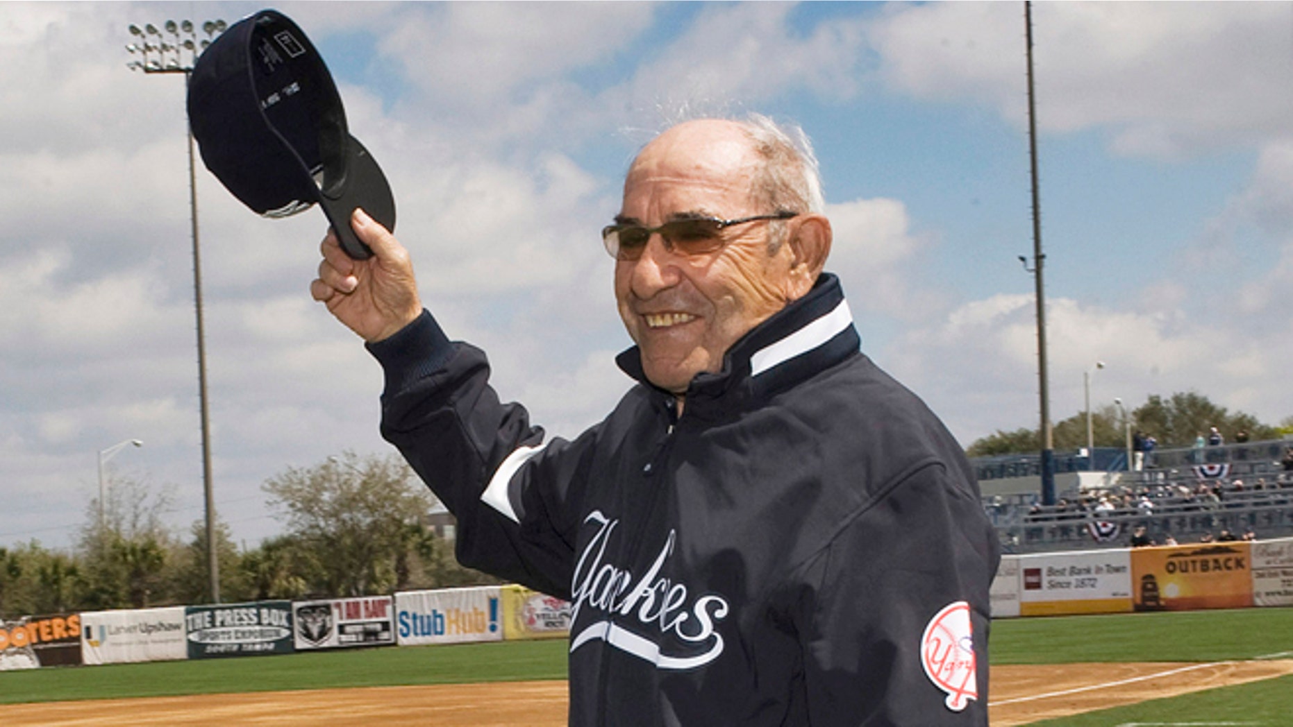 March 3, 2010: Former New York Yankees' player, manager and coach Yogi Berra waves to the crowd before the Yankees home opener spring training baseball game against the Pittsburgh Pirates at George M. Steinbrenner Field in Tampa, Florida.