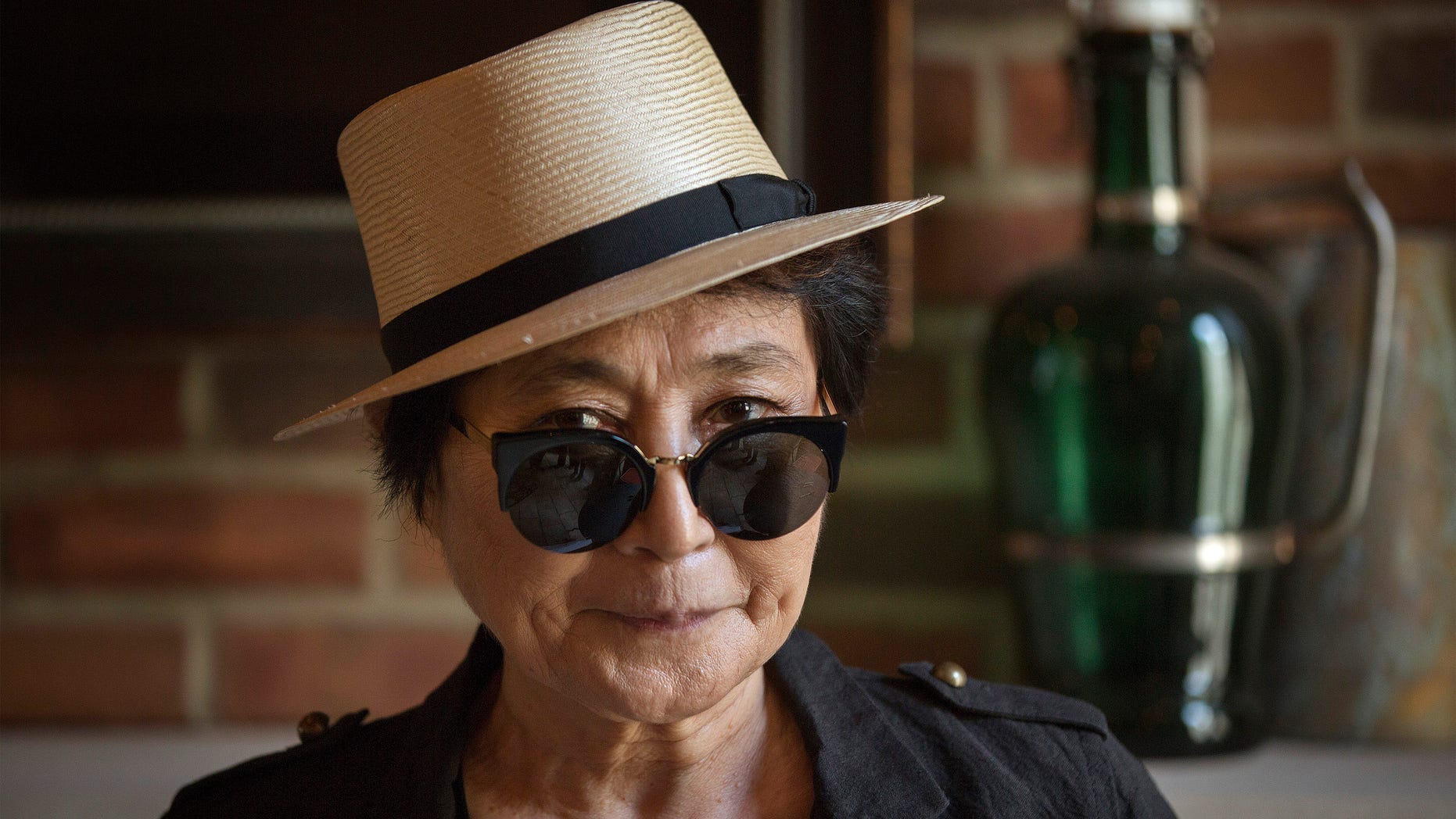 July 2, 2013. Yoko Ono poses for a photograph while promoting her new book "Acorn" during a book signing in New York.